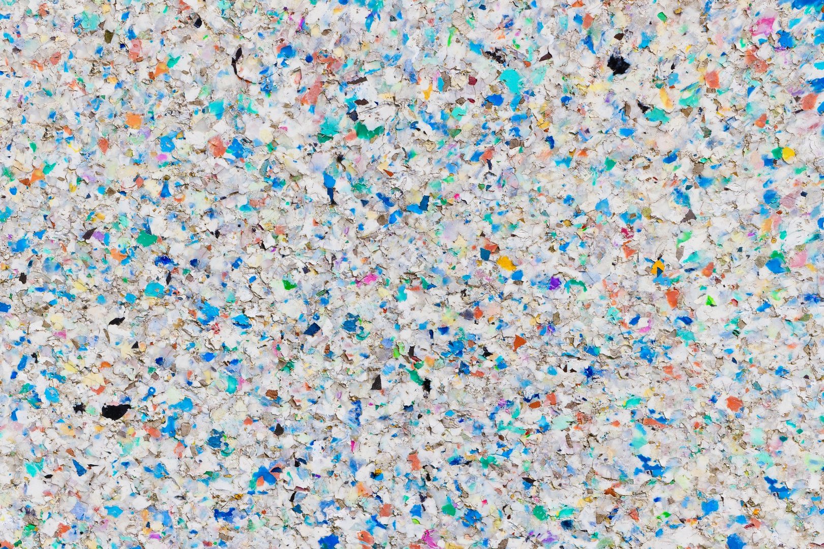 dissolving board made of multicolored recycled plastic pellets