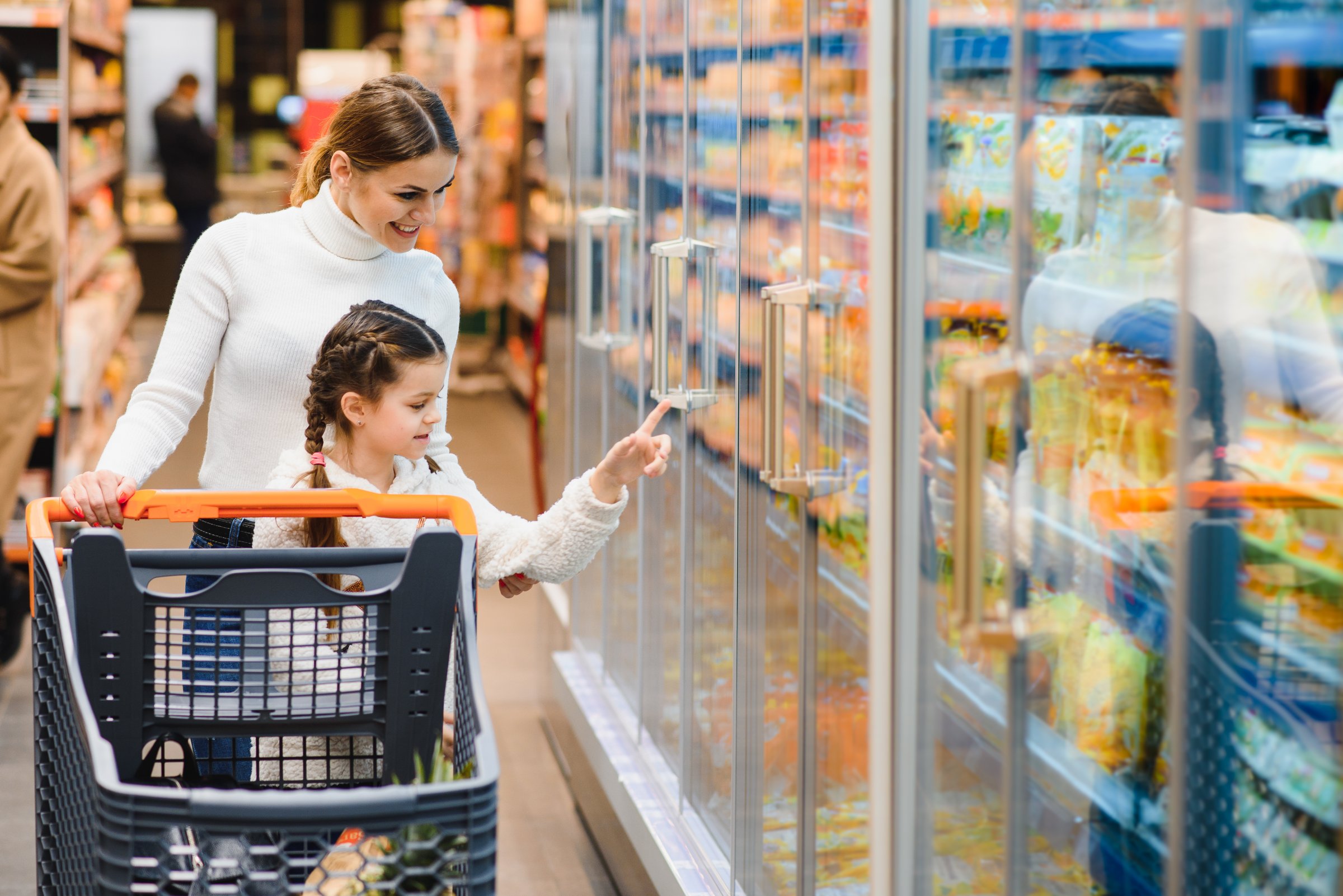 Mother with daughter at a grocery store
