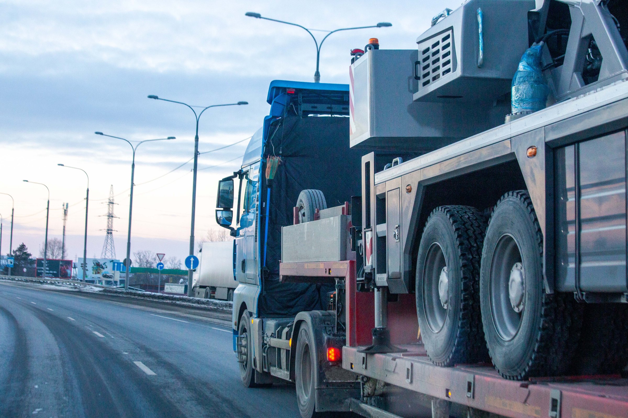 The trailer transports heavy equipment