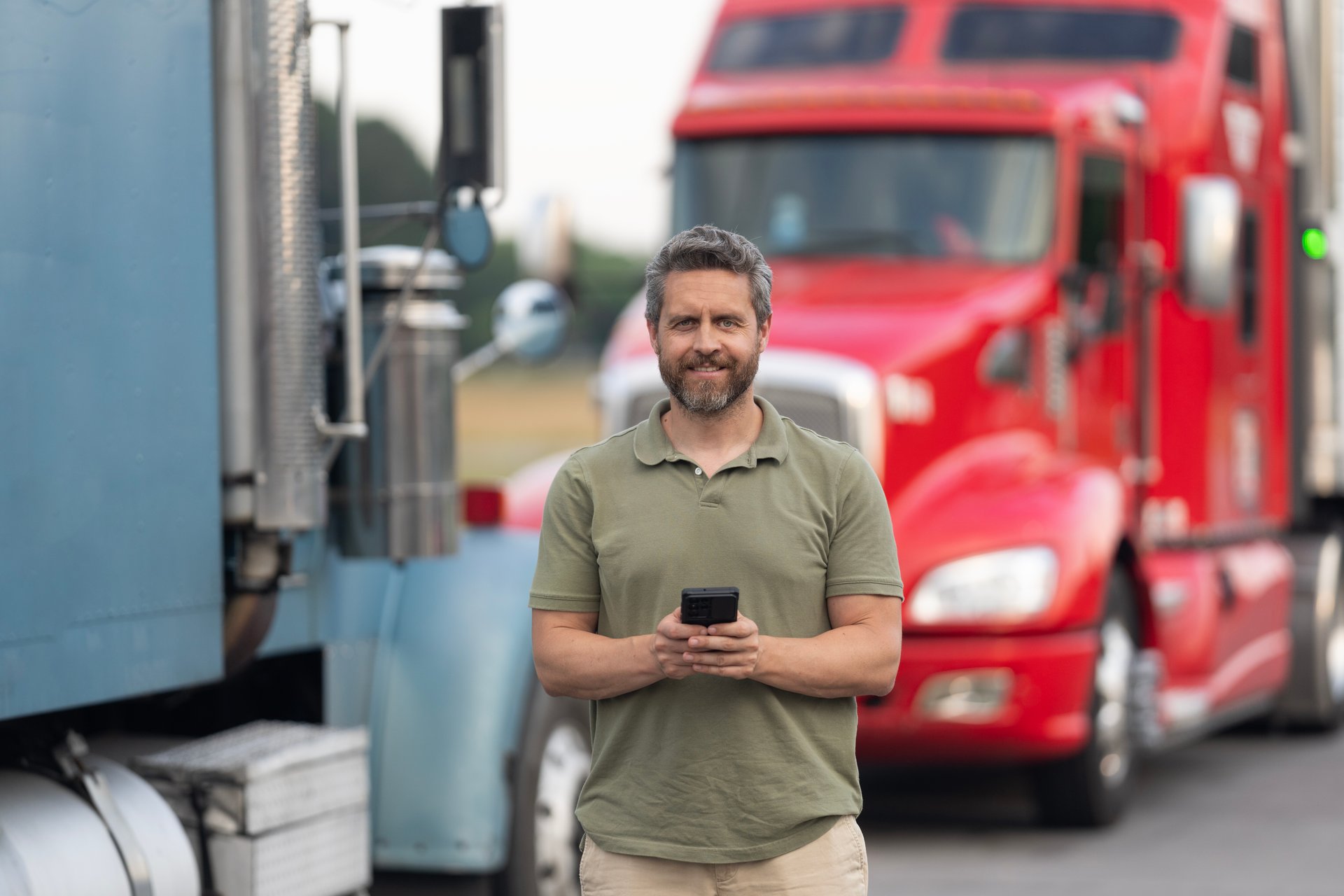 Tracking delivery. Truck driver. Trucking owner planning route. Tech logistics. Hispanic man control truck. Man owner truck driver. Transportation logistic. Delivery app. Logistics software.