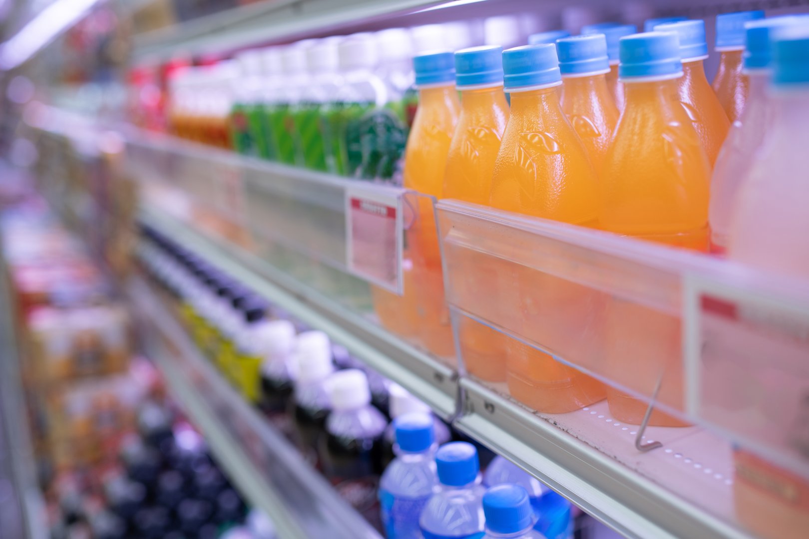 Many plastic bottled drinks on display
