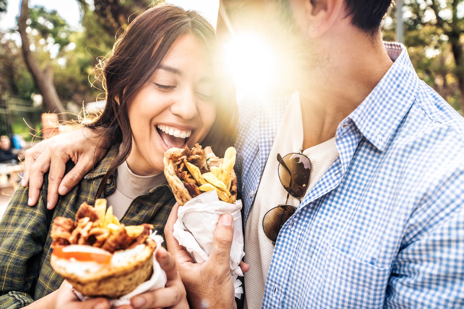 Happy couple eating gyros