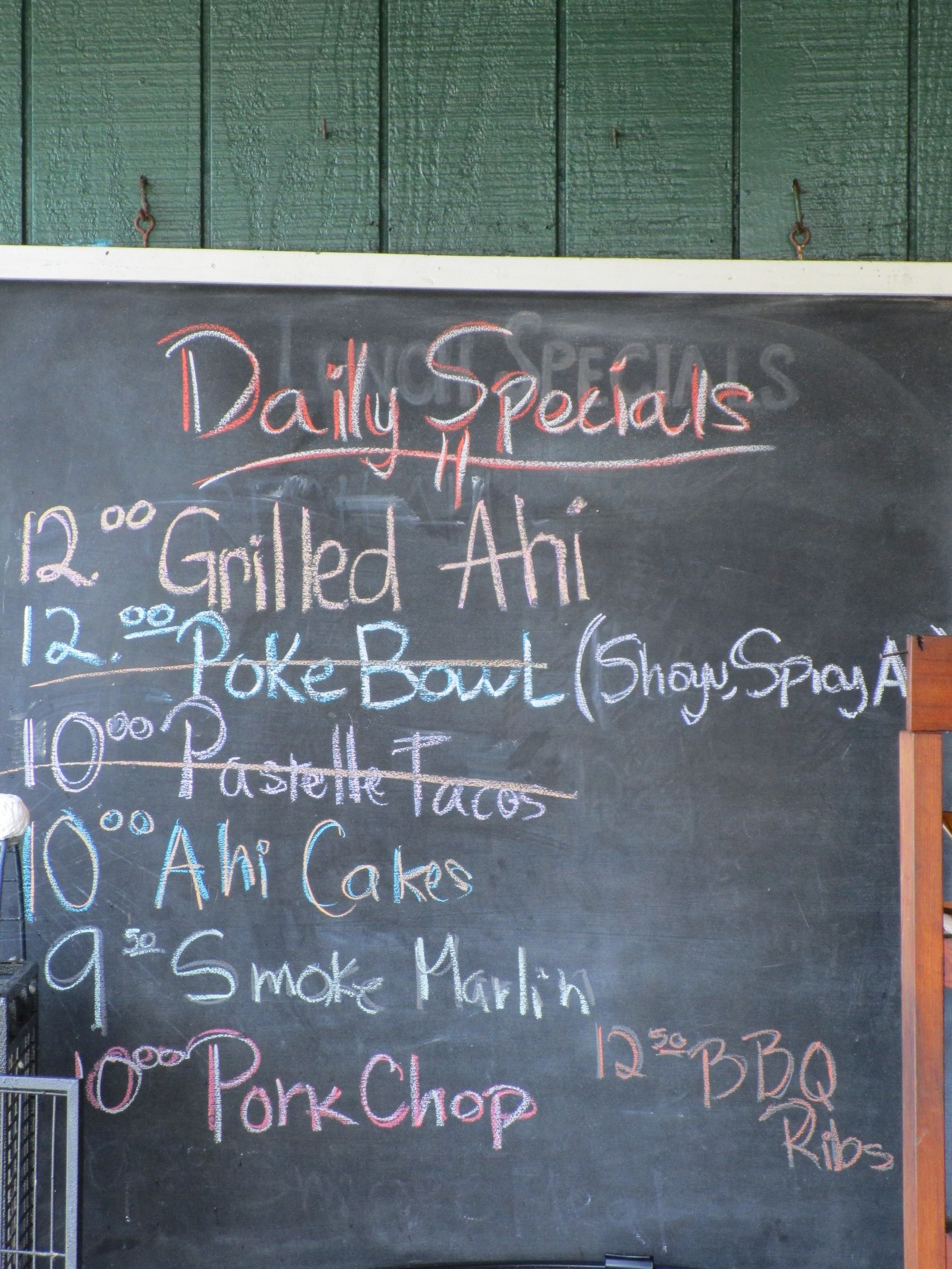 Chalk board with a list of the daily specials including many fresh sea food dishes, yummy.