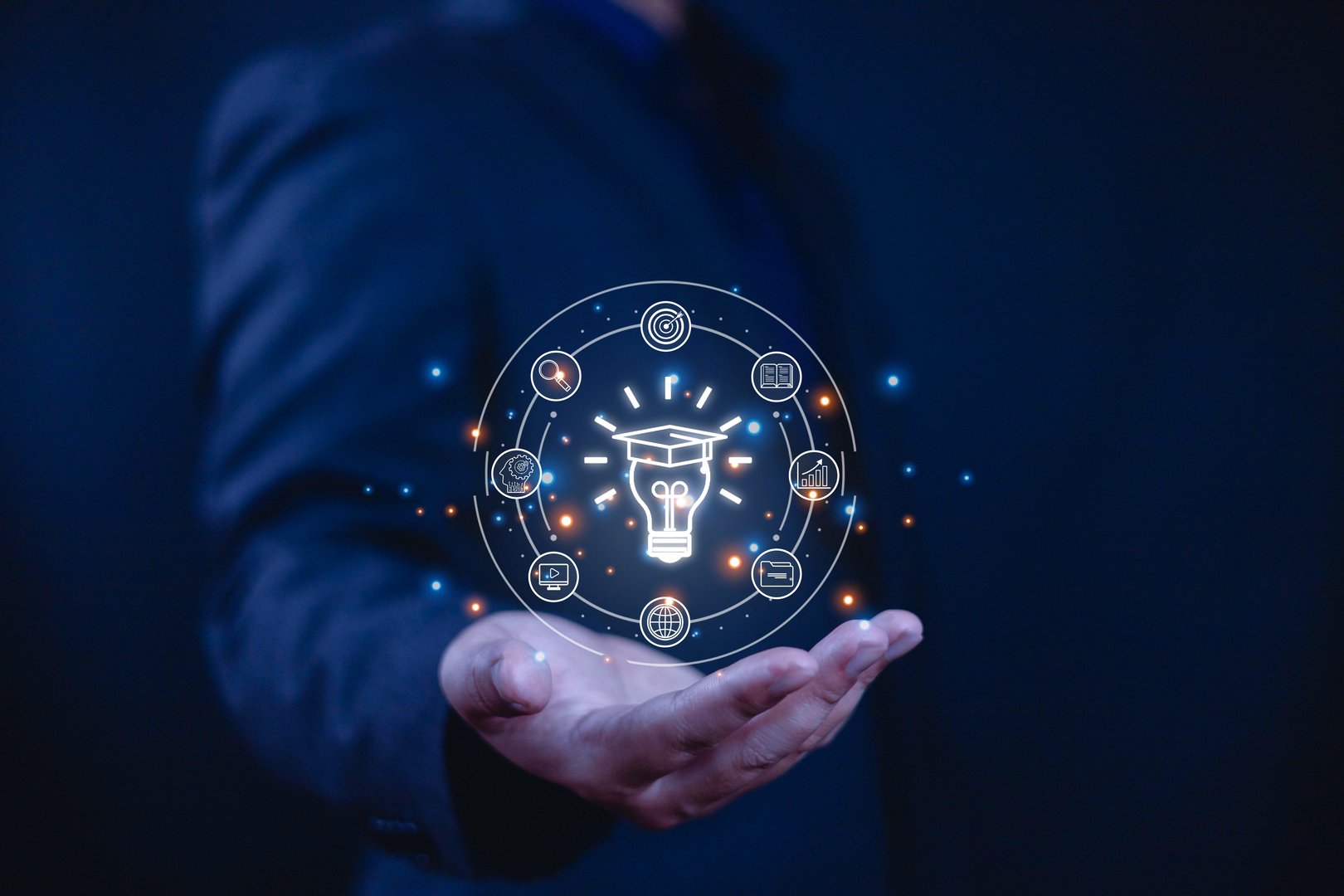 E-learning concept, Businessman showing e-learning icons on hand. Learning online educate technology provides easy access, Learning through online greater enhance. training digital online