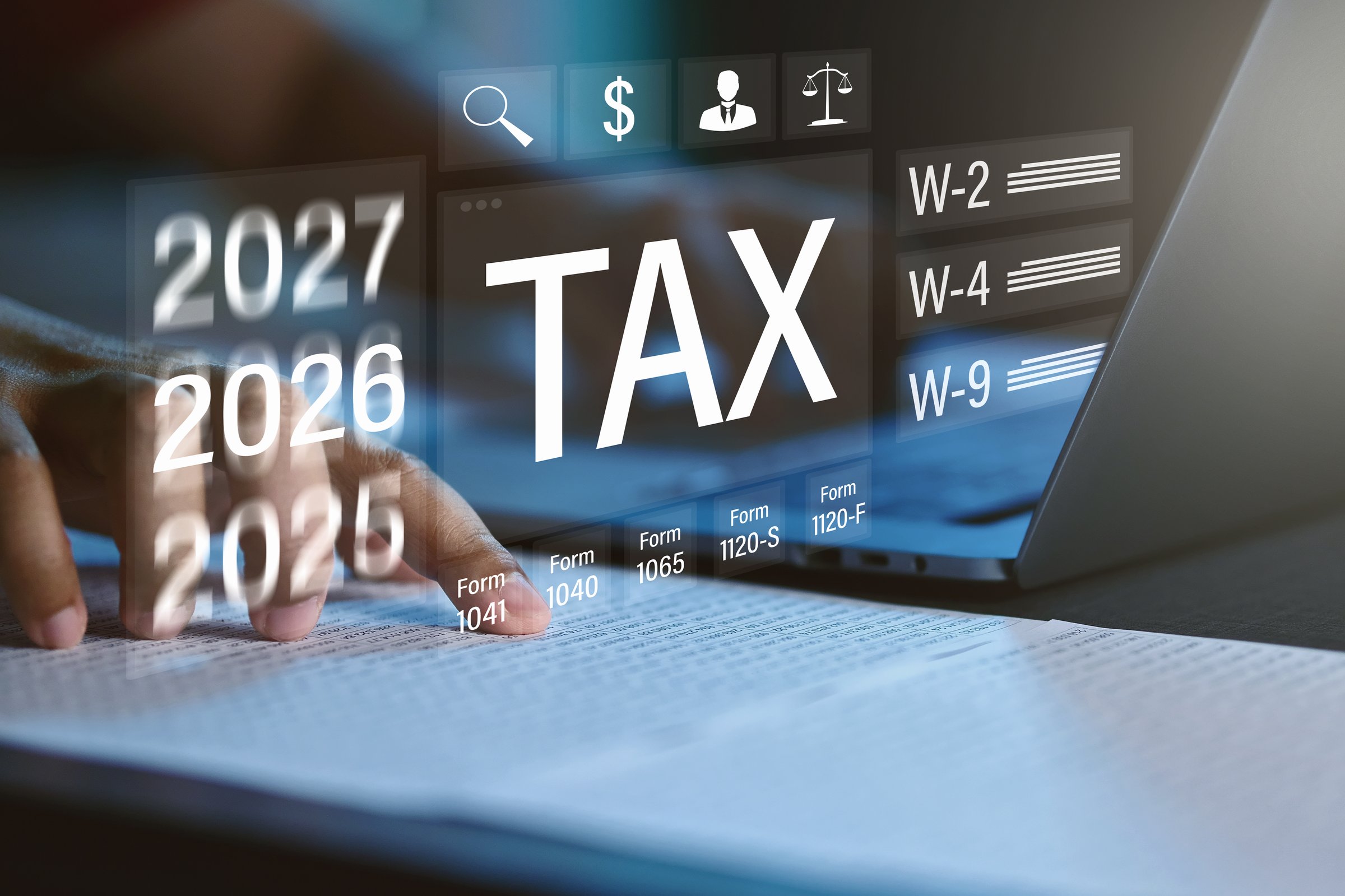 Tax form, online tax filing, tax season, a person filling out a tax form using a computer and calculating numbers.