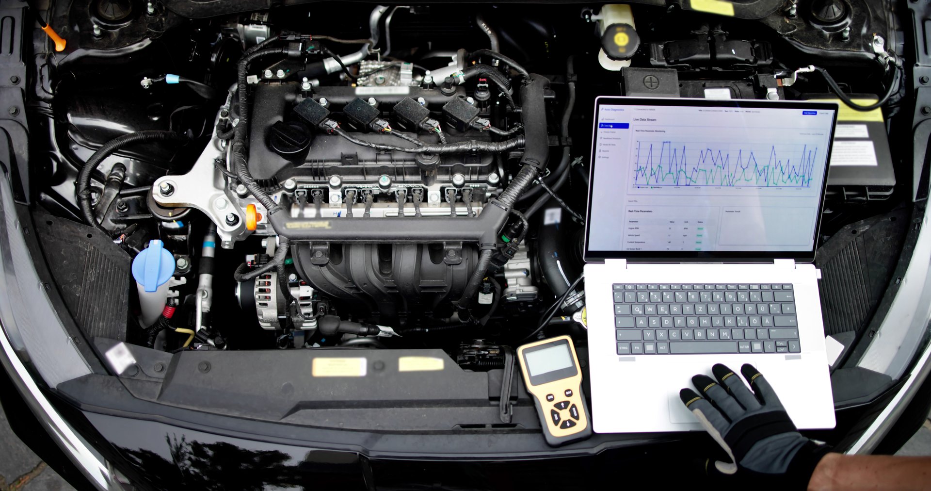 Skilled Male Mechanic Uses Laptop For Car Diagnostics In Garage. Proves Expertise And Professionalism