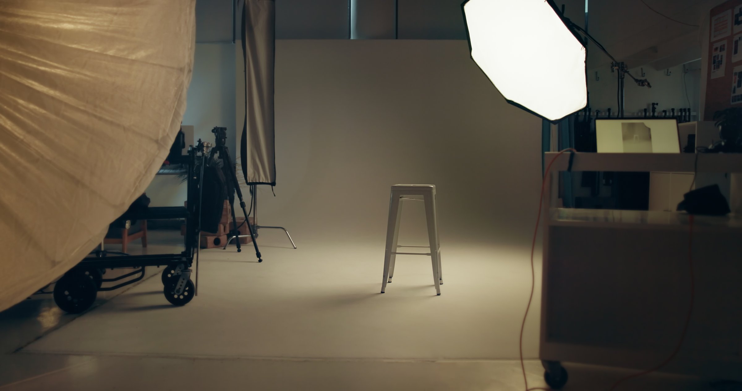 Photoshoot, stool and studio set for photography with media session for magazine project. Equipment, chair and background for creative editorial, design or lighting with empty space at art agency