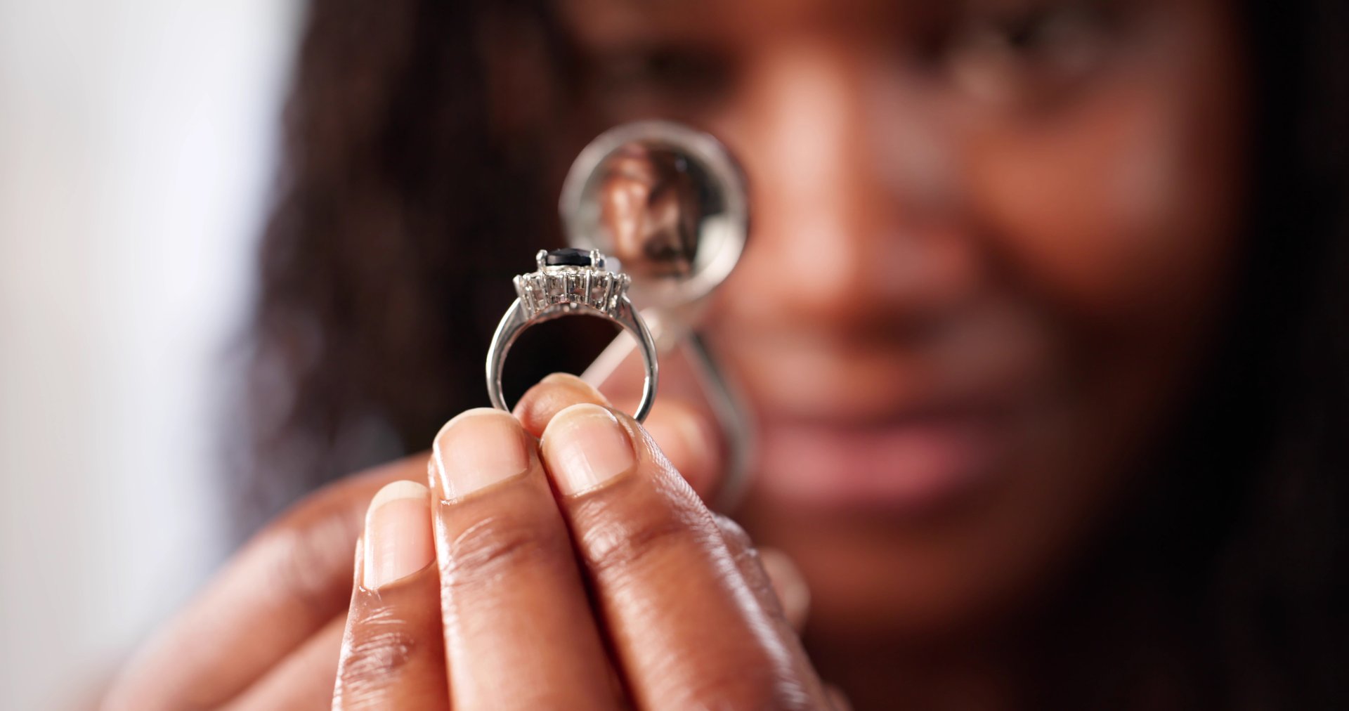 Woman Inspecting Diamond With A Magnifier, Jewelry Designer At Work.