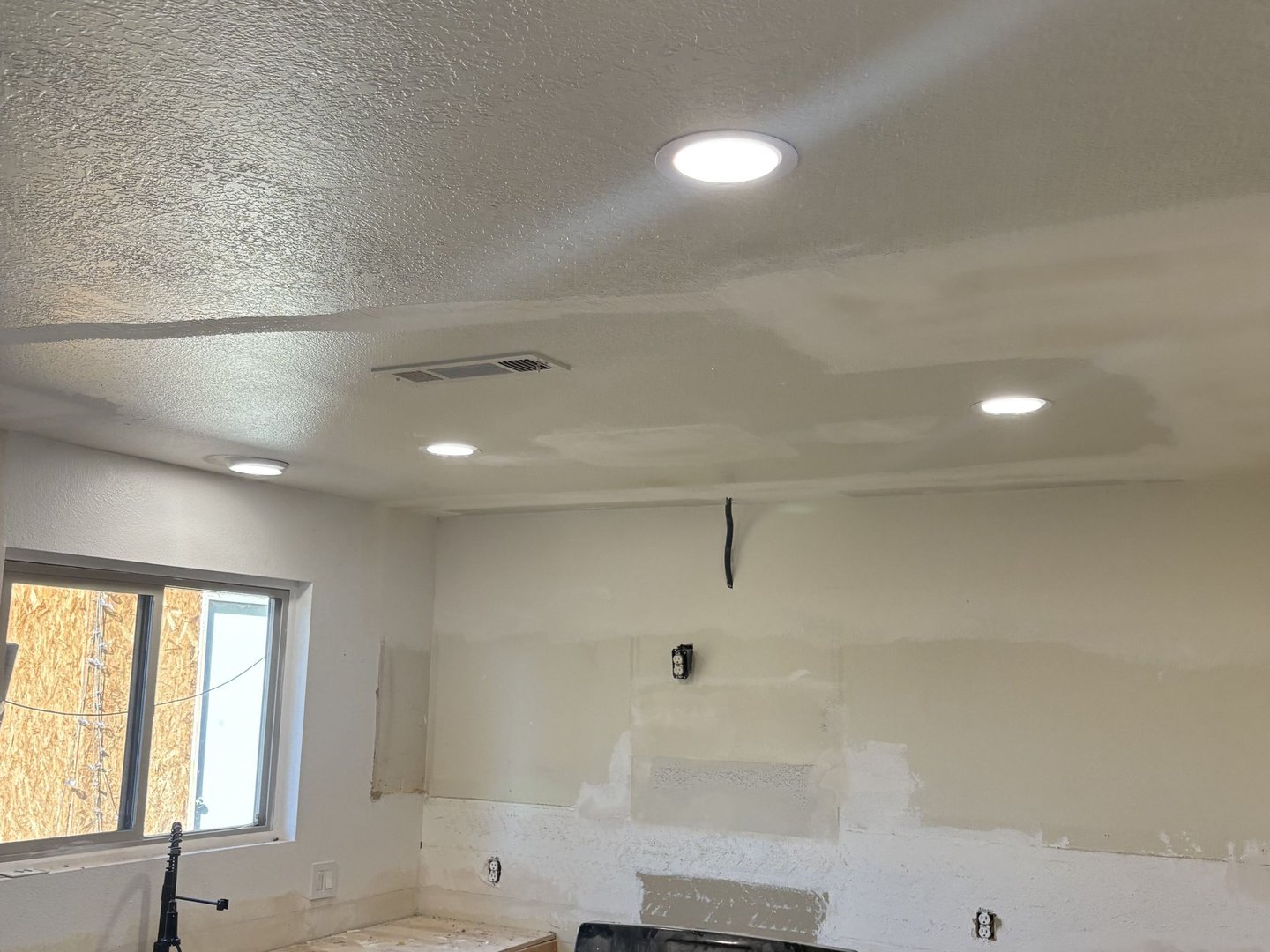 Electrician working on home renovation electrical project