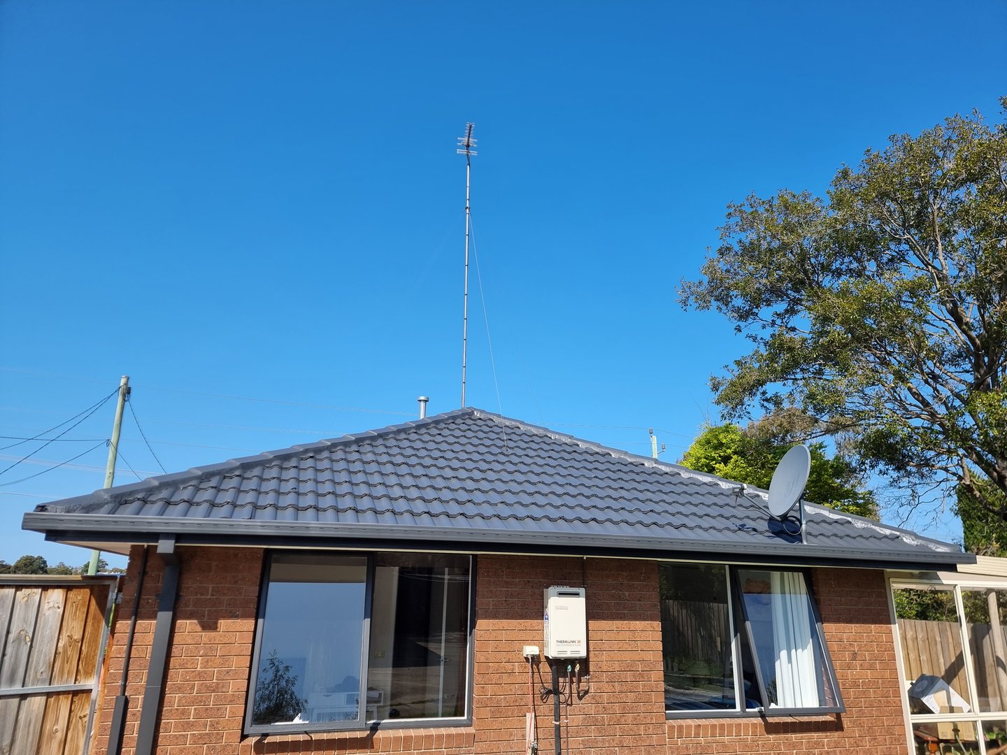 Quality Painting Group tile roof project completed restoration showing finished results