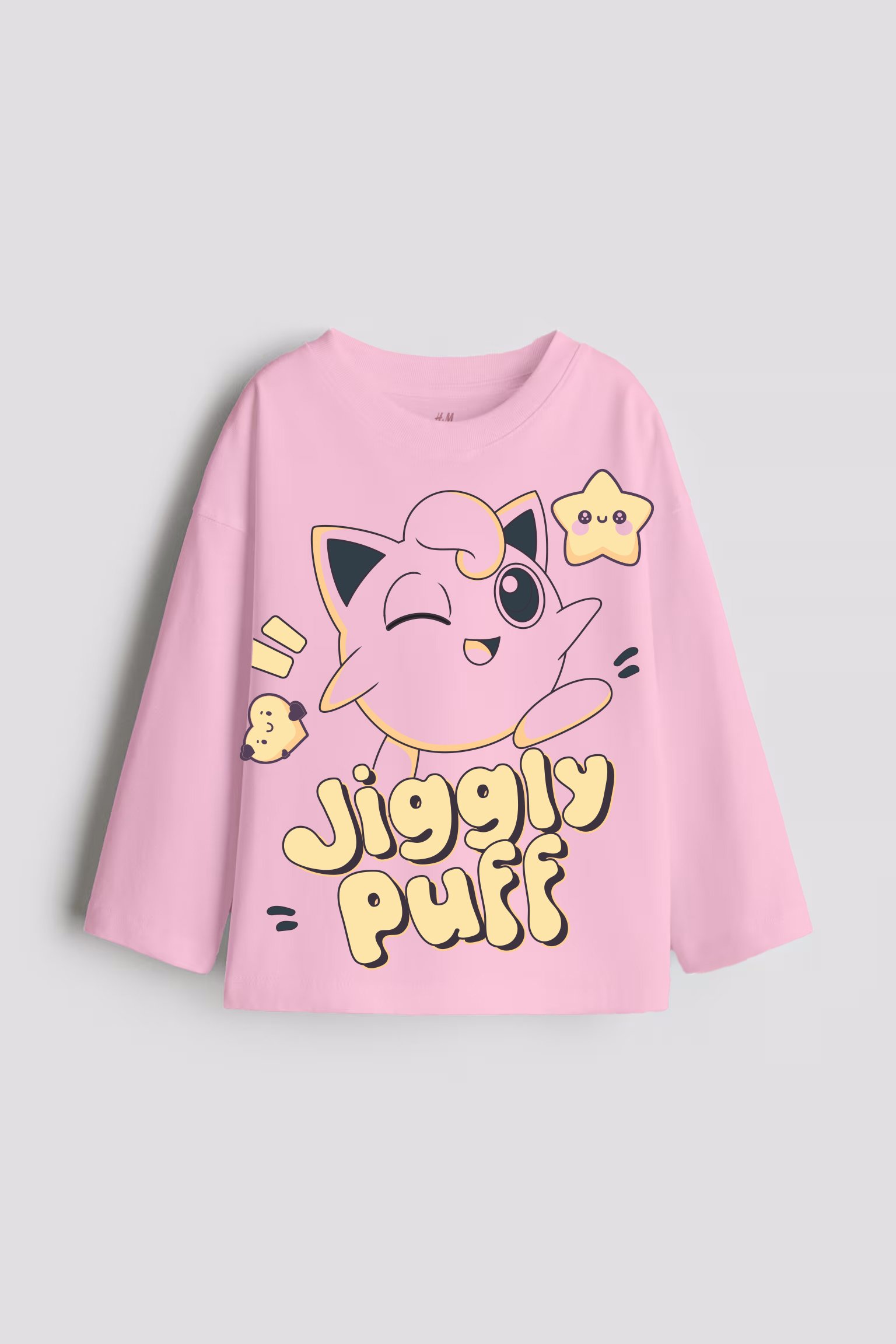 Pink shirt with a winking Jigglypuff cartoon and the text "Jiggly Puff." Features stars and musical notes.