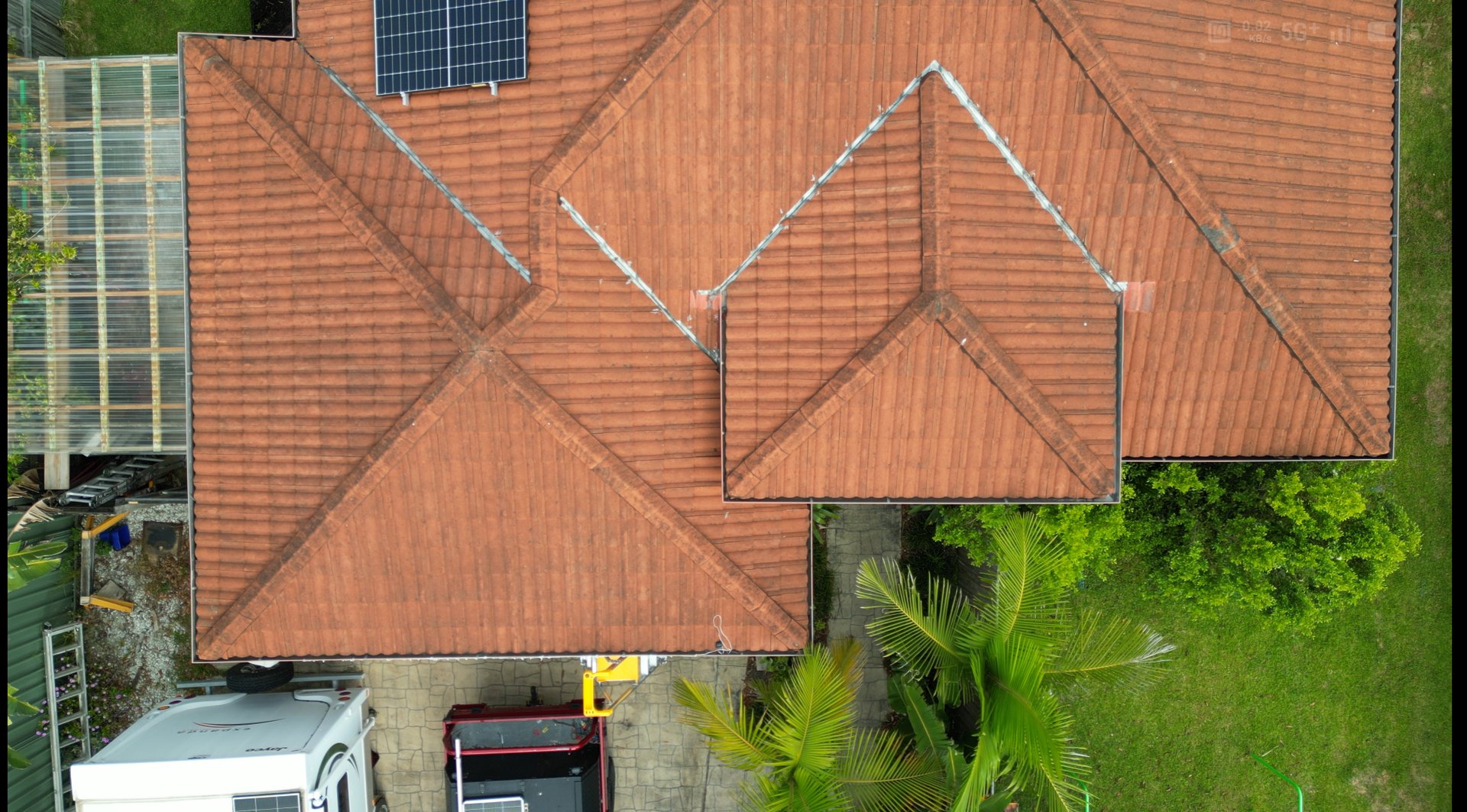 comparison roof top before and after cleaning moss lichen with industrial high pressure water cleaner tiles