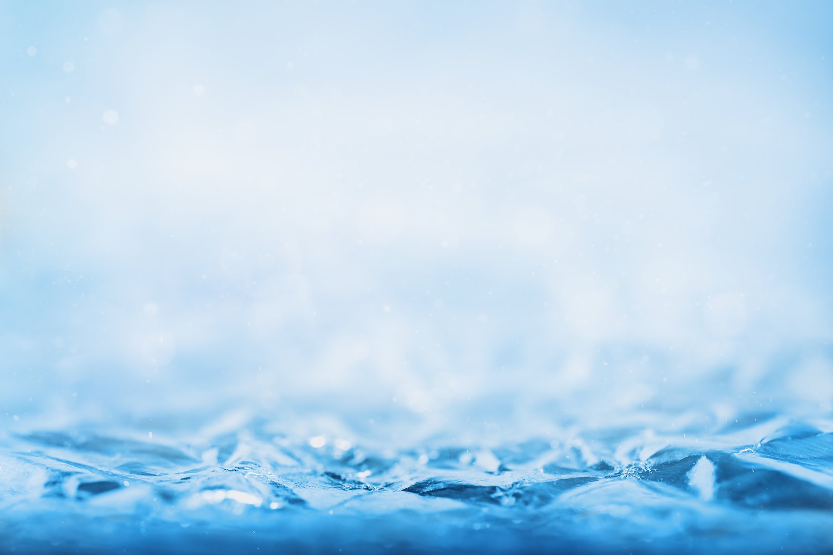 Abstract blue winter background with crispy ice surface. Focus line for product presentation