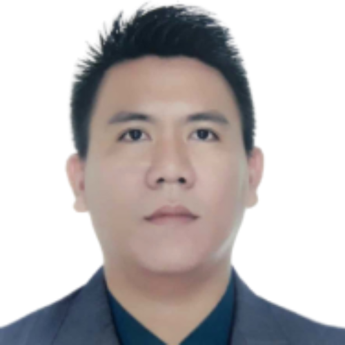 Man in a dark suit with short black hair posing for a formal photo against a plain white background.