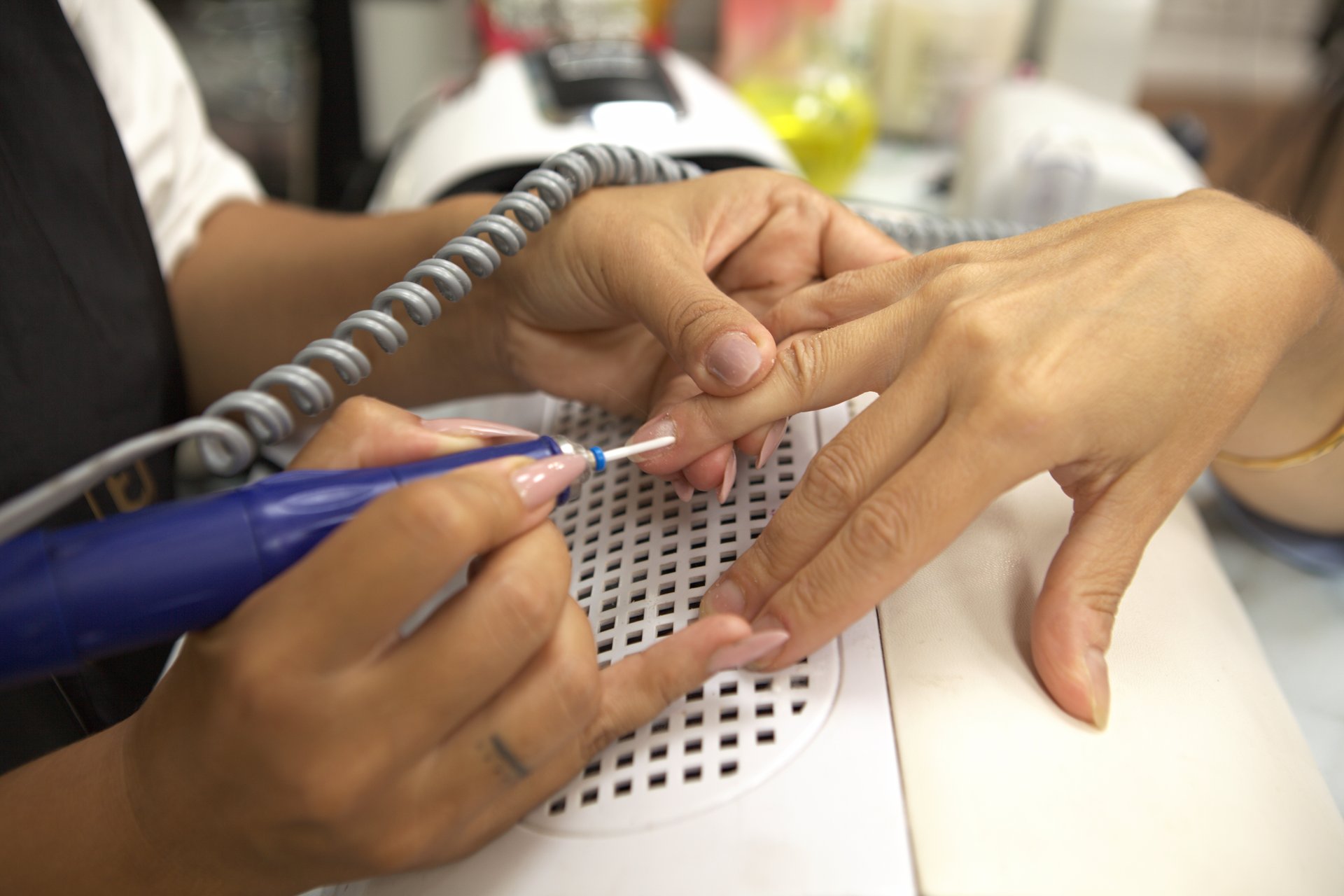 Close-up of the manicure procedure at the beauty salon.