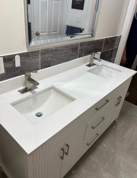 Professional plumber working on kitchen sink