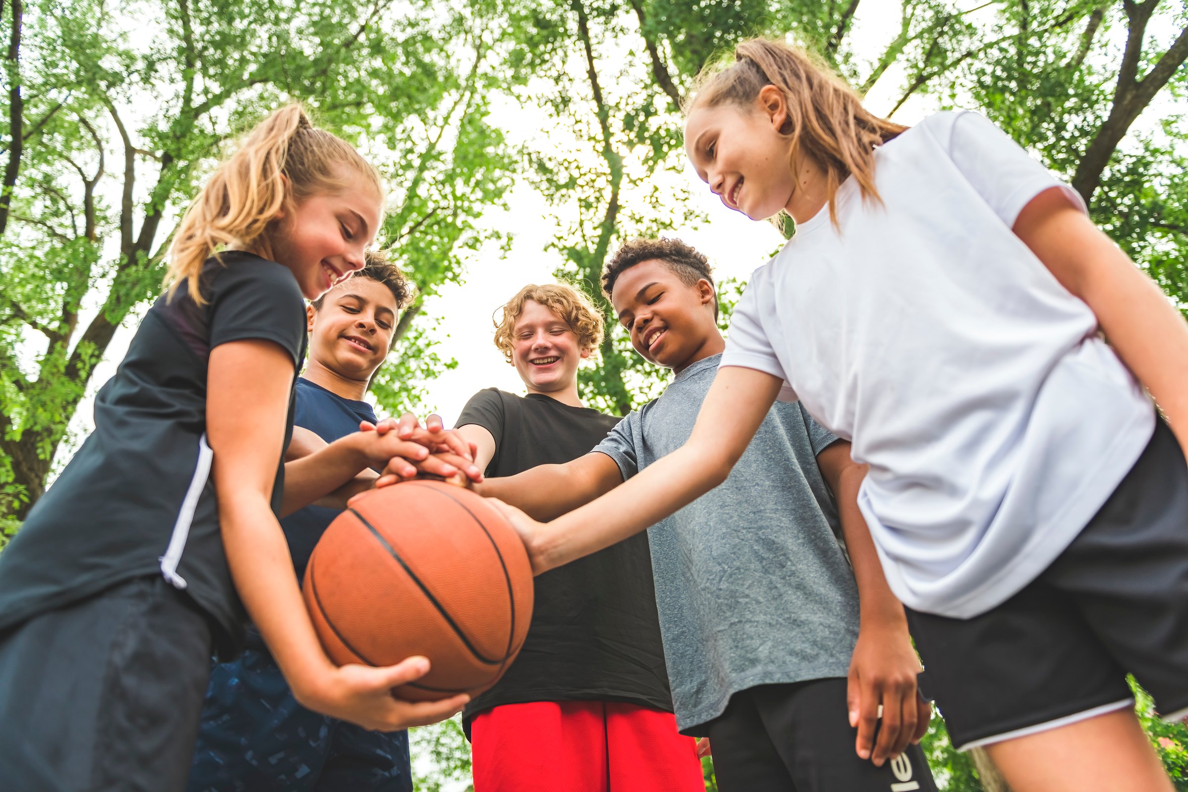 A great child Team in sportswear playing basketball game