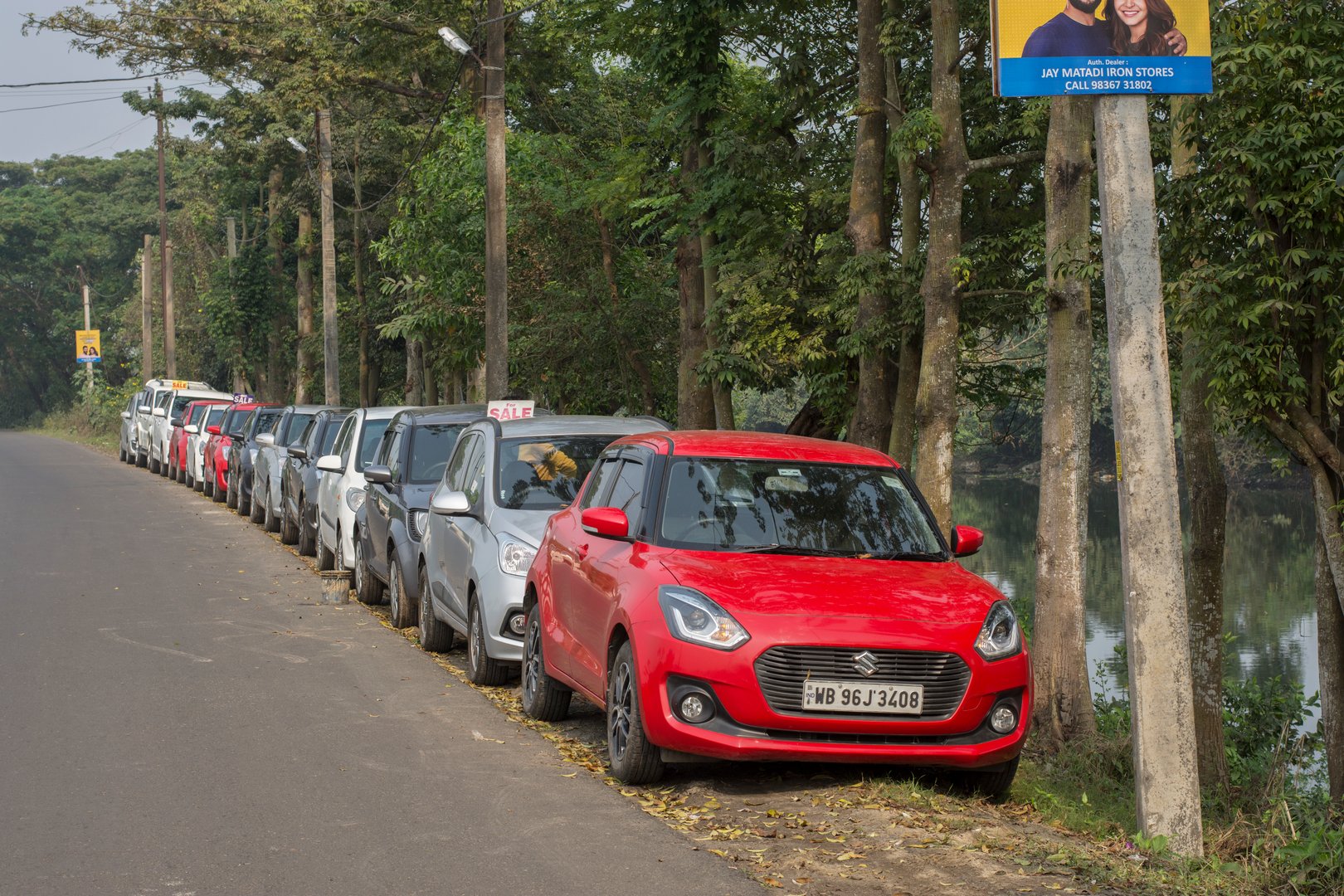 12th December, 2021, Narendrapur, West Bengal, India: Few mordern cars parked road side for sale second hand