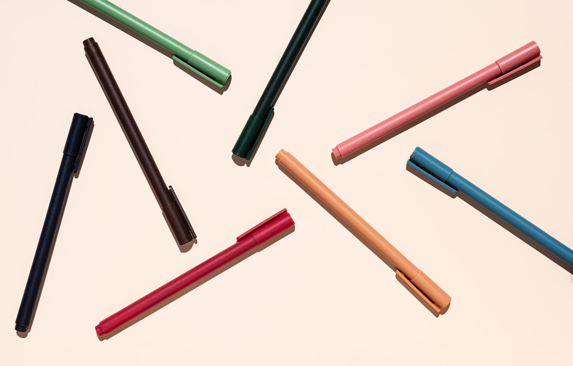 Multicolored pens layout. Stationery collection.