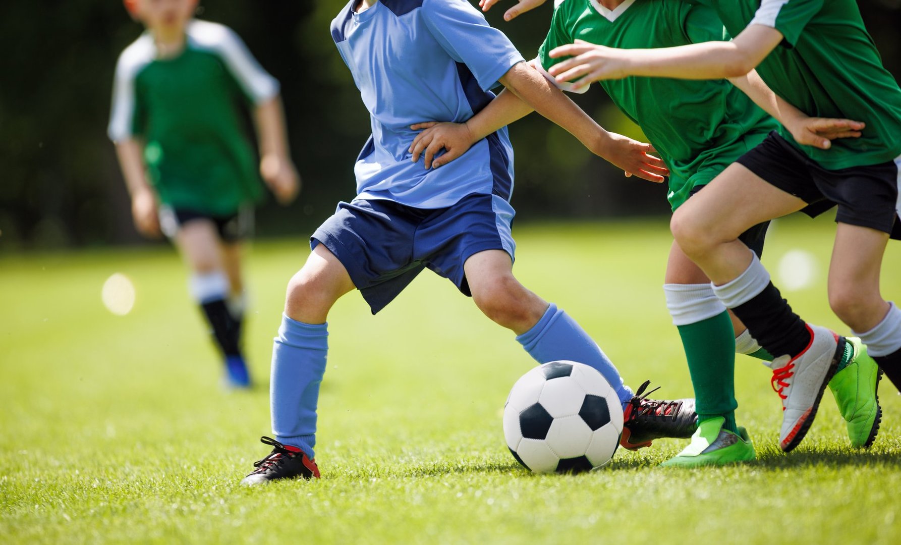 Youth Soccer Match.  Kids Playing Football on Grass Field in Team Uniforms. Children Sports Activity and Competition
