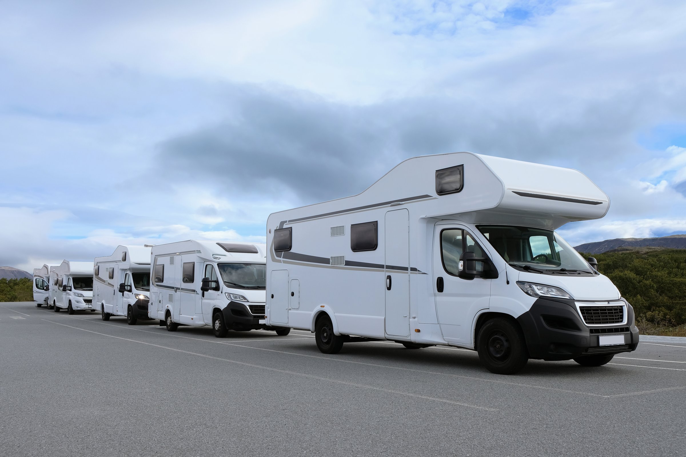 Campers parked on a caravan park. Motorhomes and camping cars for traveling.