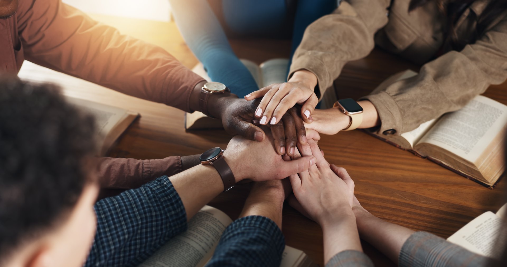 Stack of hands, collaboration and business people in office for unity, solidarity and support. Team building, top view and group of corporate employees with partnership, goal or trust in workplace.