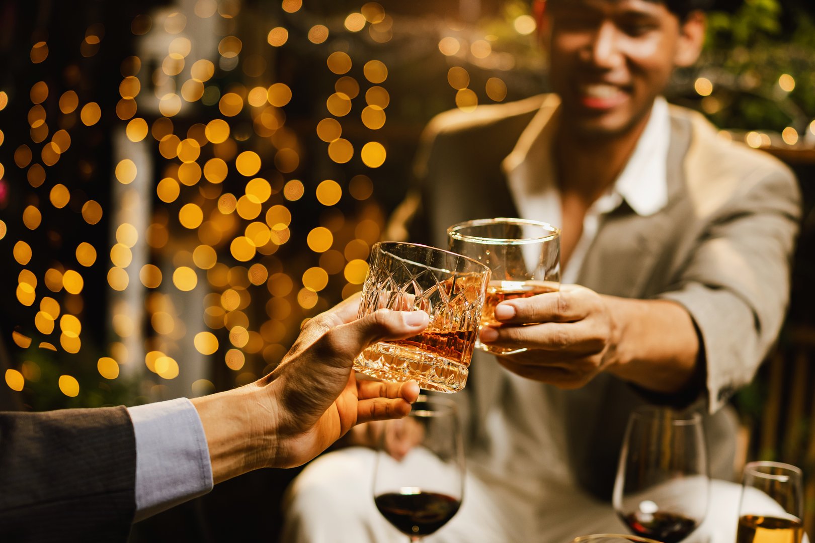 Happy two man clinking glasses of whiskey in celebration, Holiday, Festival celebration, Friendship and celebration concept.