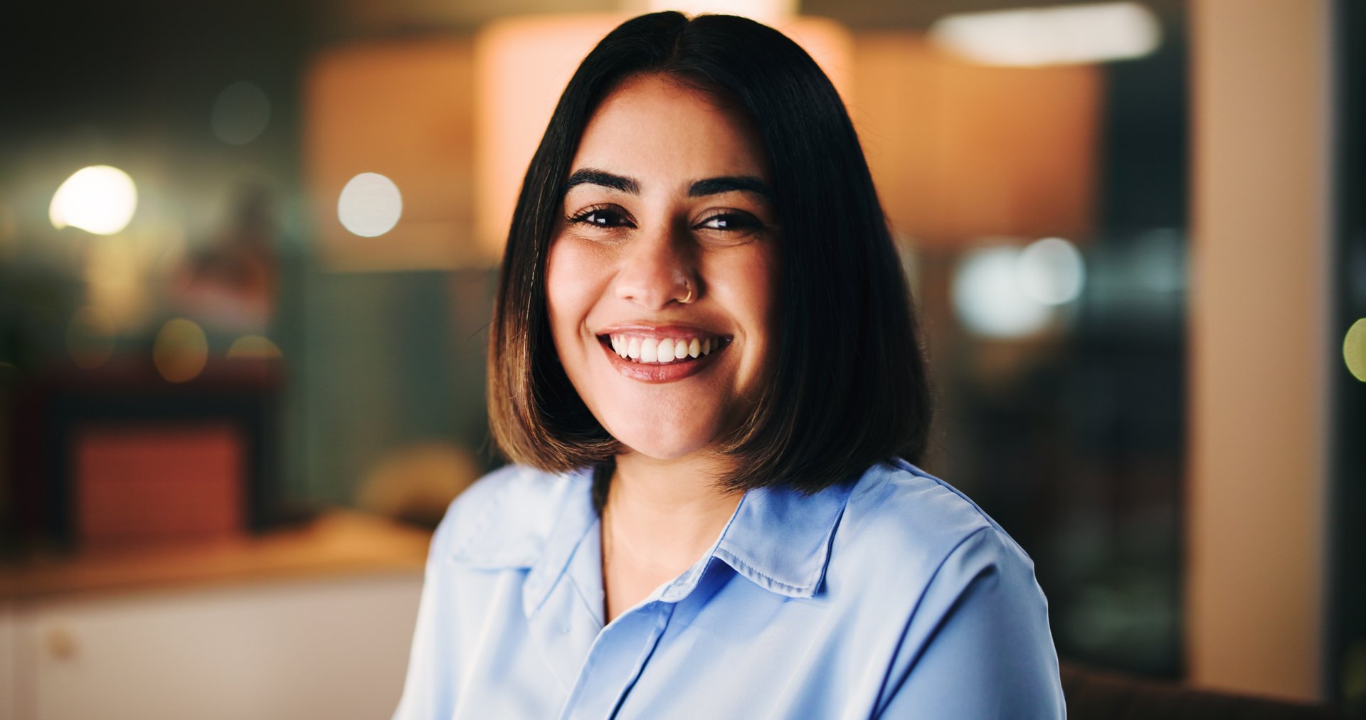 Professional, woman or bokeh in office with portrait, consultant or talent acquisition in company. Happy, corporate or person in business with smile, HR manager or onboarding for training employees.