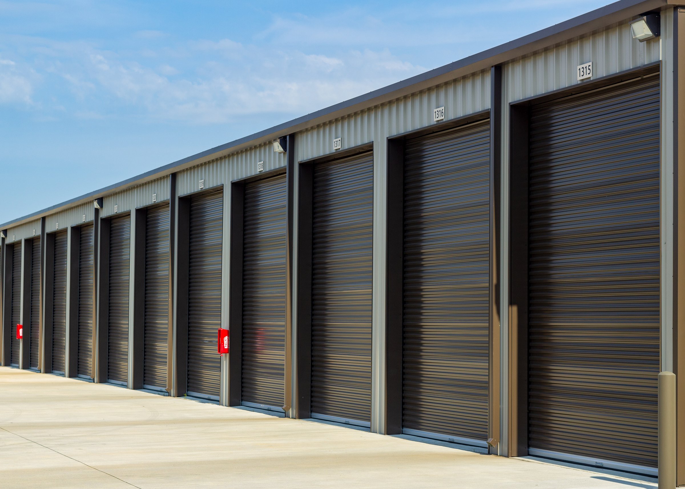 Row of outdoor mini storage units in Conroe, TX.