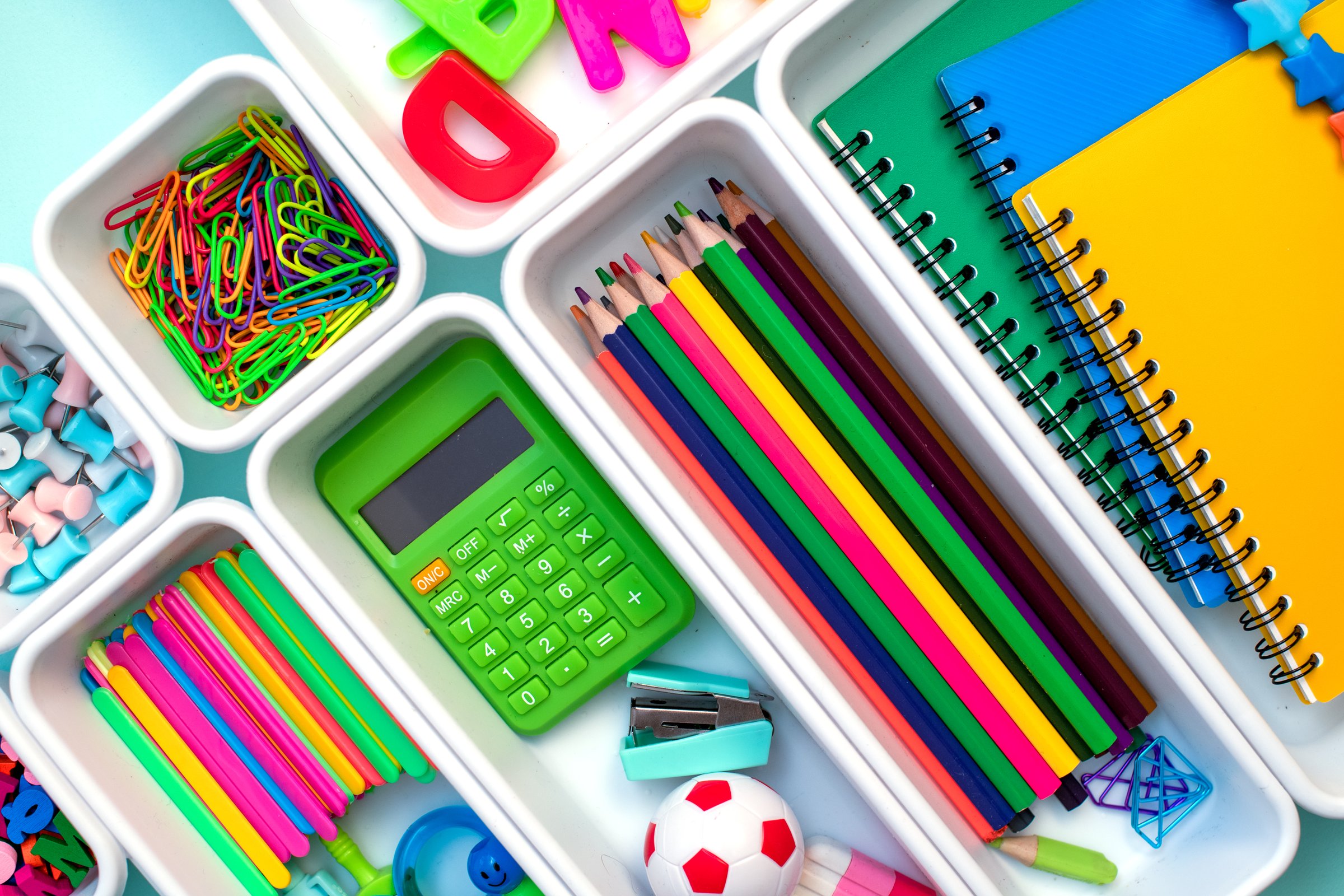 School supplies.Concept back to school. colored stationery is arranged in white organizers. Creative Drawer Organizing. Storage office supplies