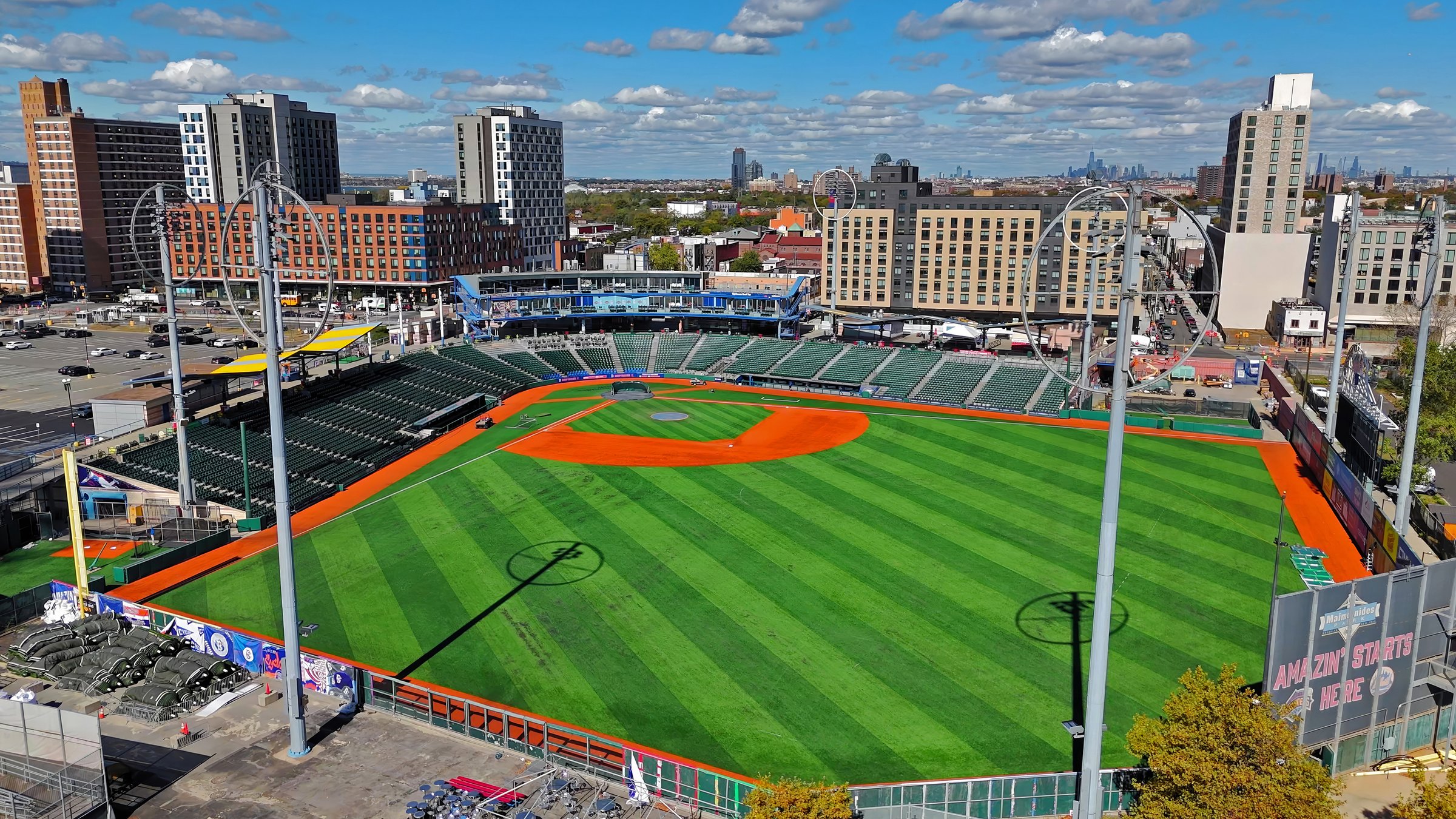 Brooklyn , United States - 11.10.2024. Aerial view of Maimonides Park baseball stadium in Brooklyn. Elevated view of Maimonides Park, home of the Brooklyn Cyclones, showing the well-maintained baseball diamond and empty green stands surrounded by urban buildings under a partly cloudy sky.