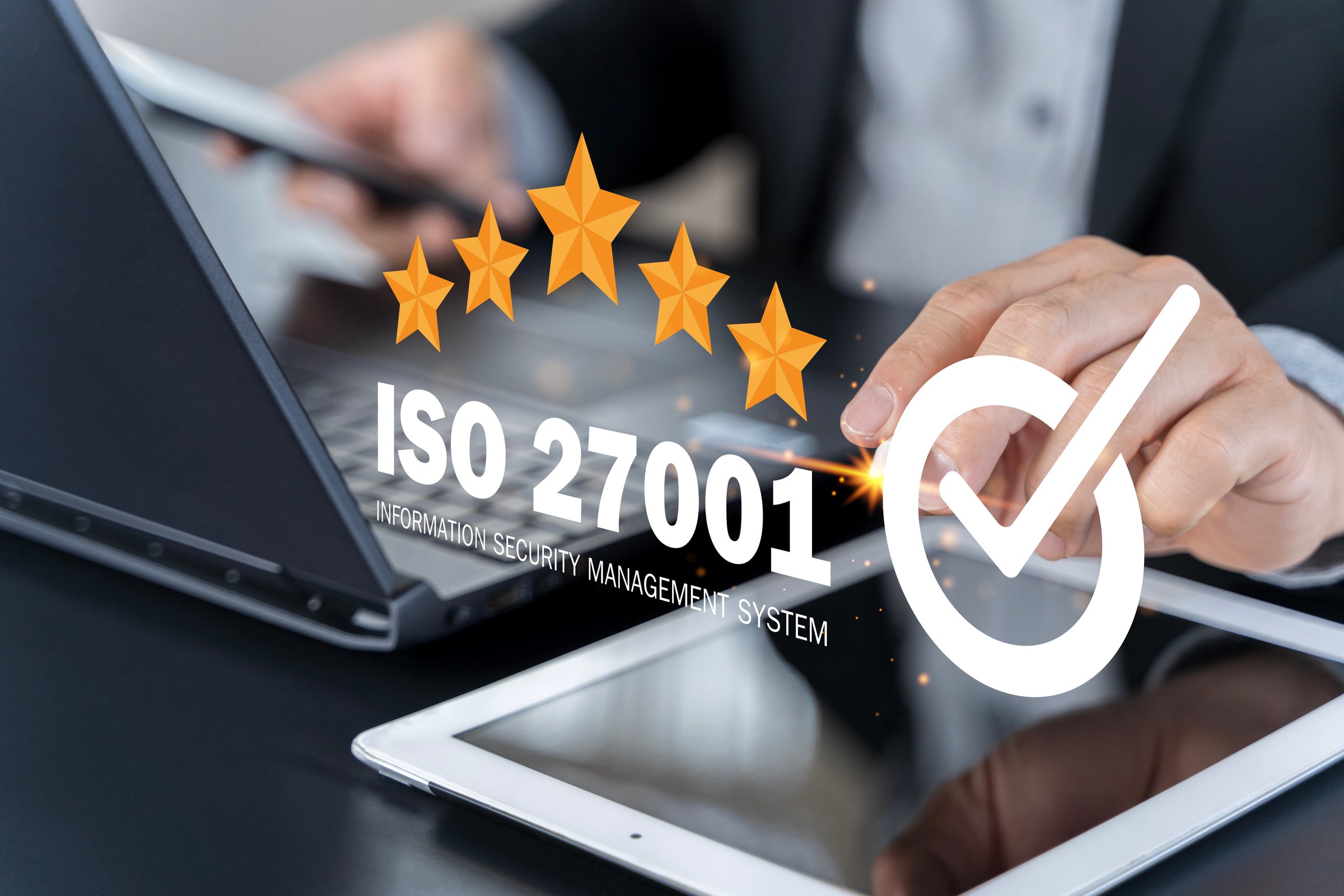 ISO 27001 concept. Businessman with ISO 27001 certified for information security management system (ISMS). requirements, certification, management, standards