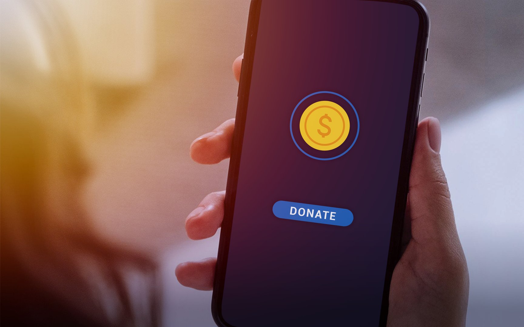 Hand Holding Smartphone for Online Donation Mobile App