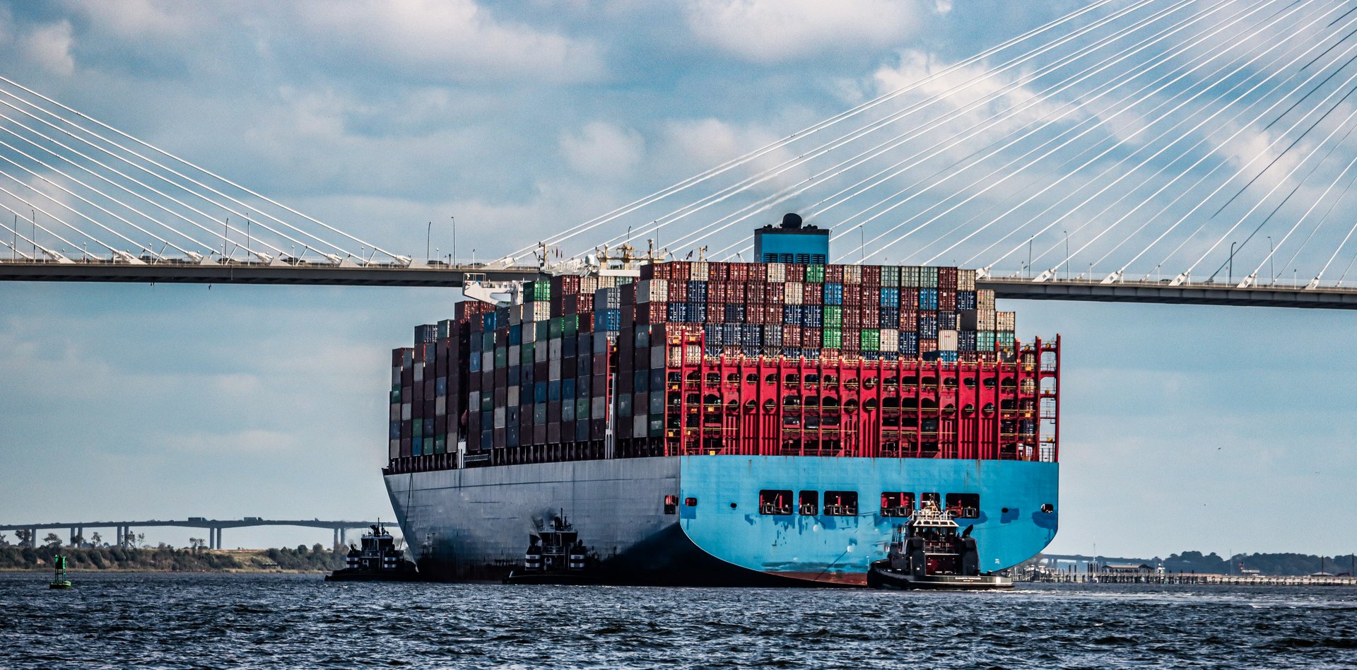 A big freighter gets ready to float under the Cooper River Bridge in Charleston, South Carolina.