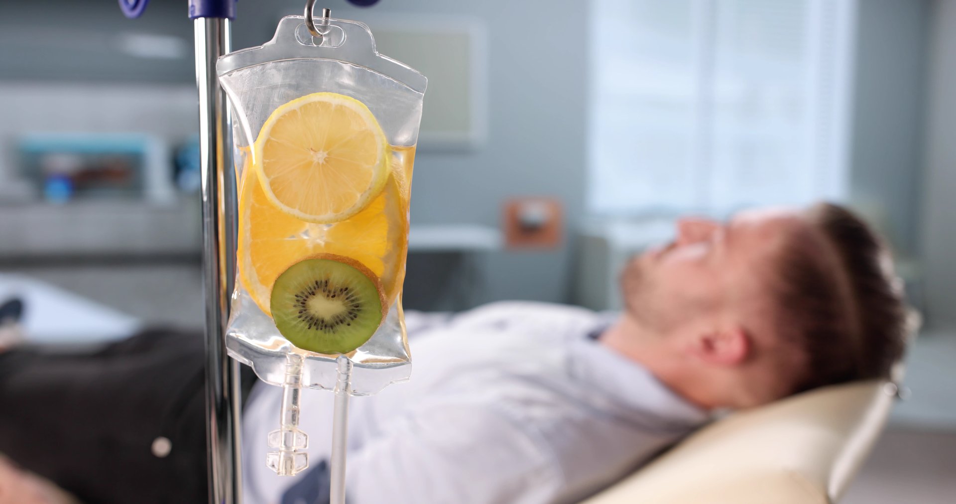 The Man Receives His Daily Dose Of Vitamins Through IV Therapy.