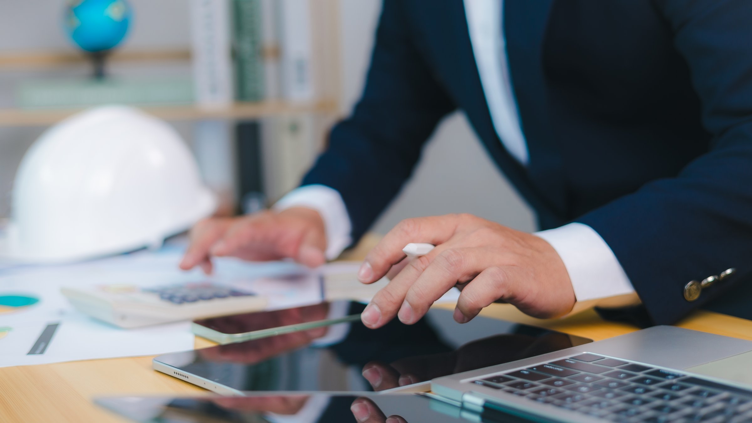 Project construction cost planning and calculation, Project presentation plan. Construction planning, structural calculation, Architect or engineer sitting at desk in office, Cost calculation.