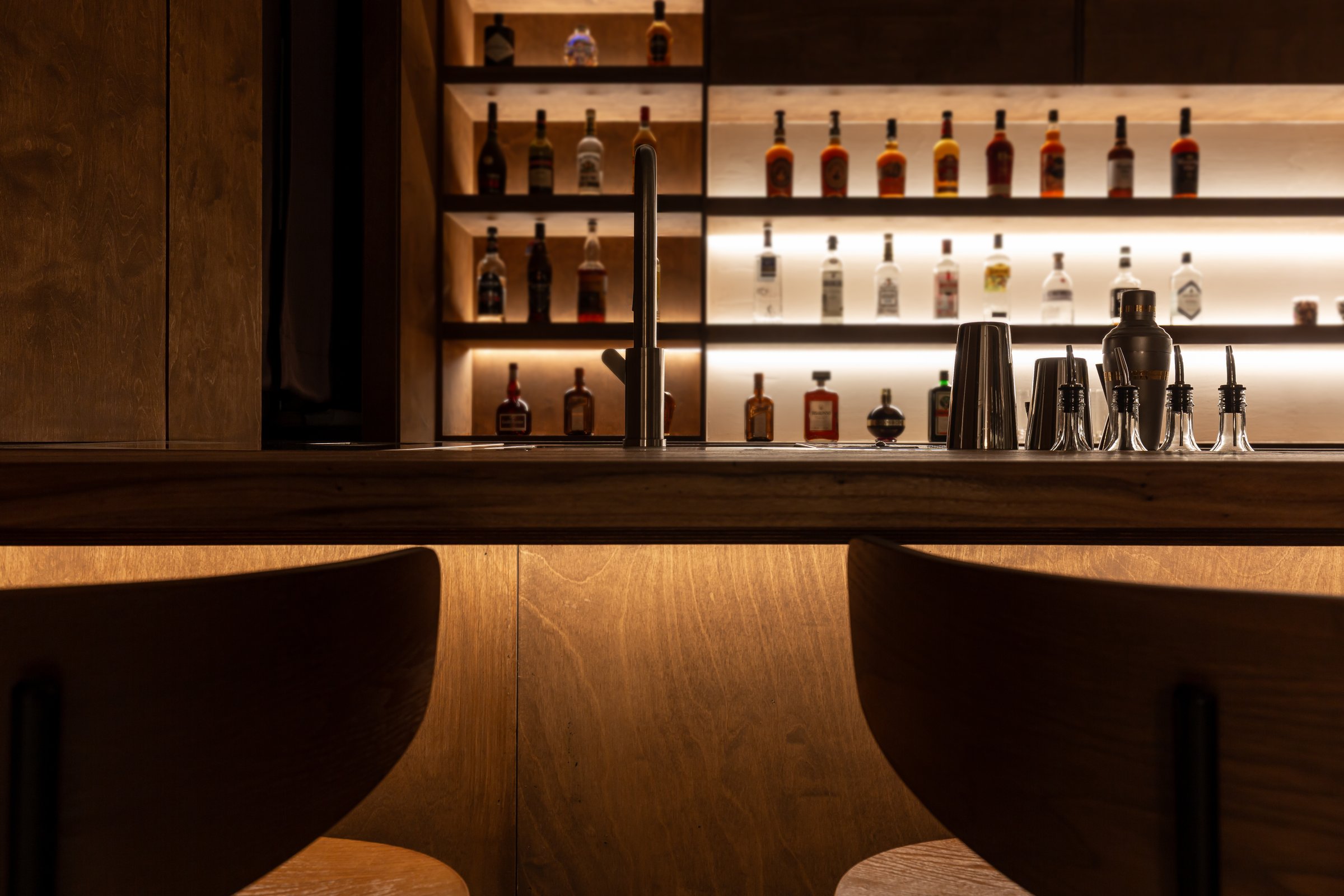 Luxury bar with drinks and bar stools