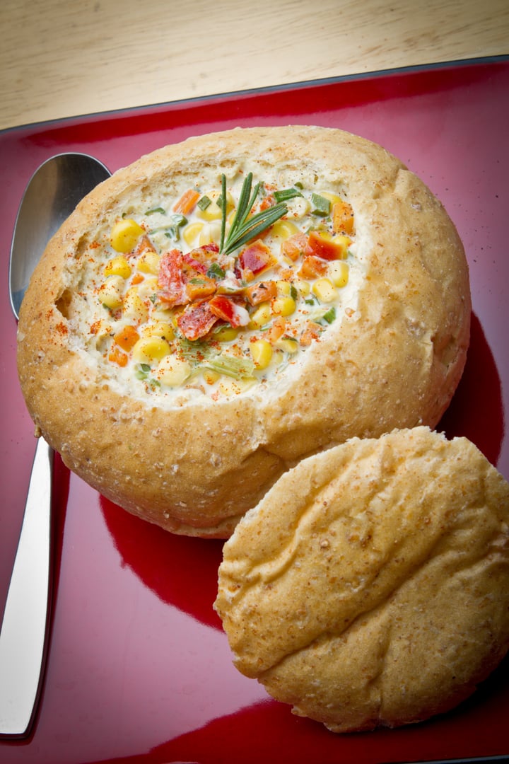 Corn Chowder in a Bread Bowl on a plate