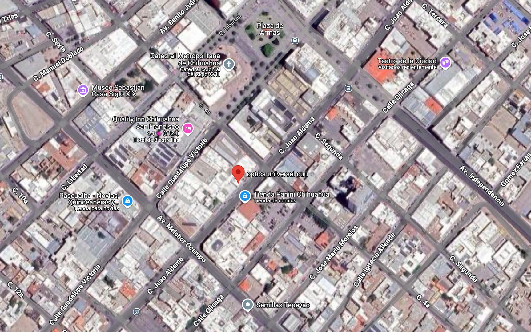 Aerial view of a city grid with labeled streets and notable landmarks like a cathedral and theater in Chihuahua, Mexico.