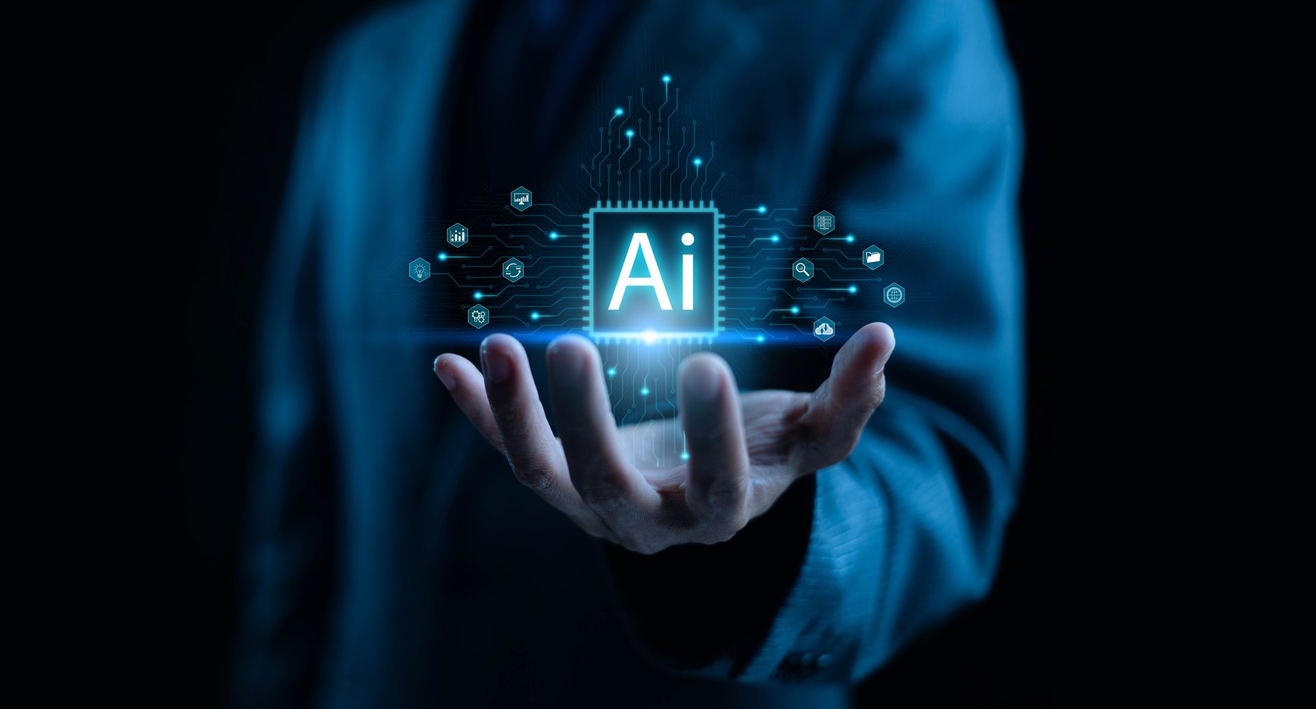 A futuristic business concept showing artificial intelligence technology glowing above a businessman's hand, symbolizing innovation, digital transformation, data analysis, and advanced AI solutions.