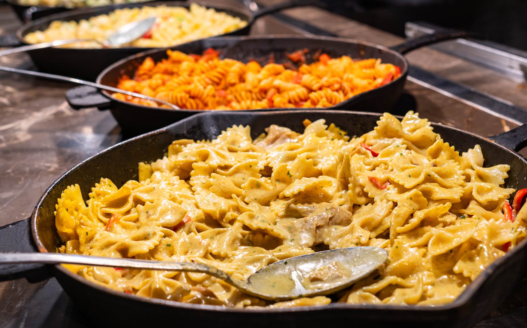 A selection of flavorful dishes served in skillets