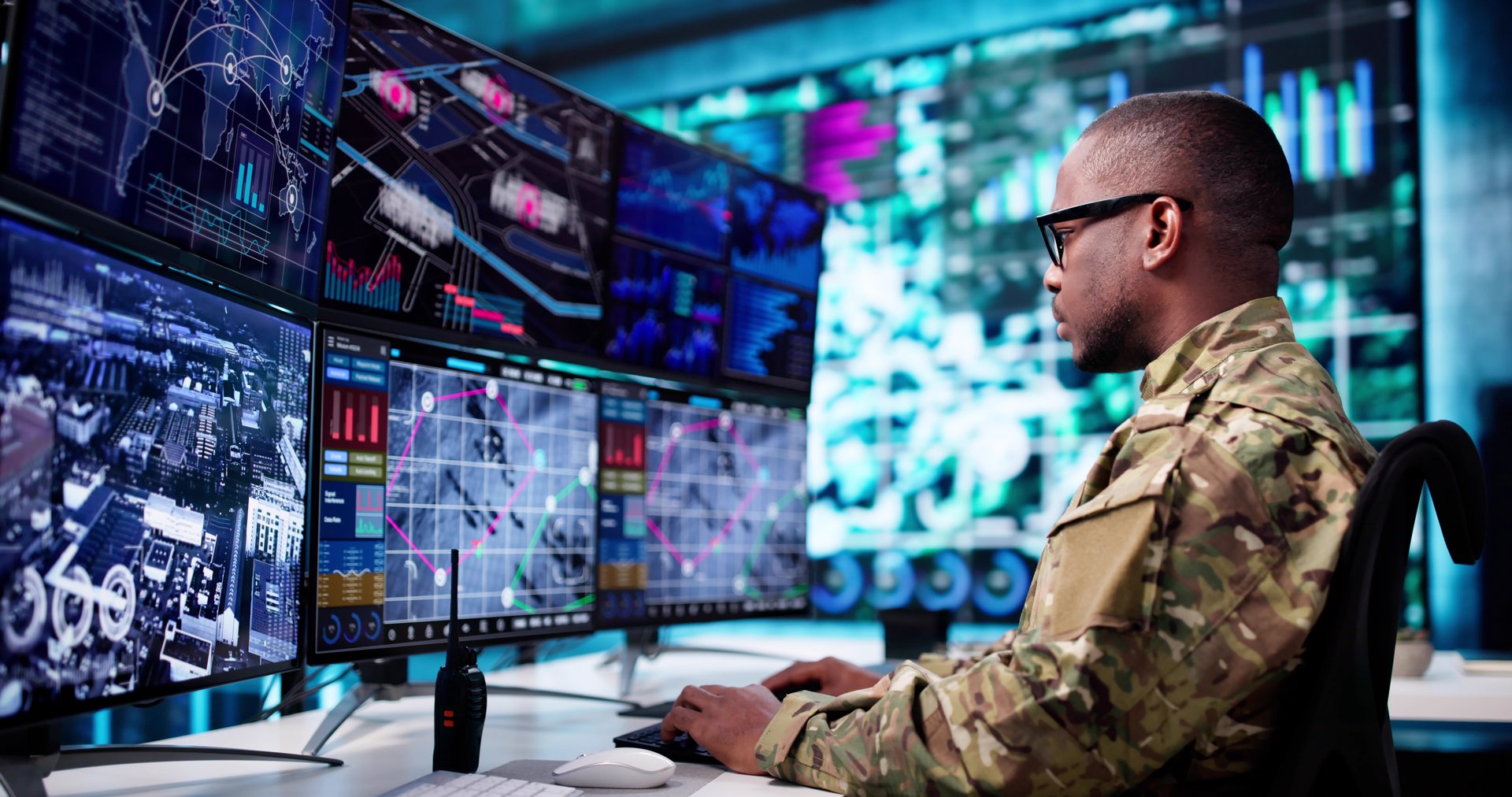 In A Military Control Center, A Young African American Man, A Cyber Technology Operator At A Government Agency