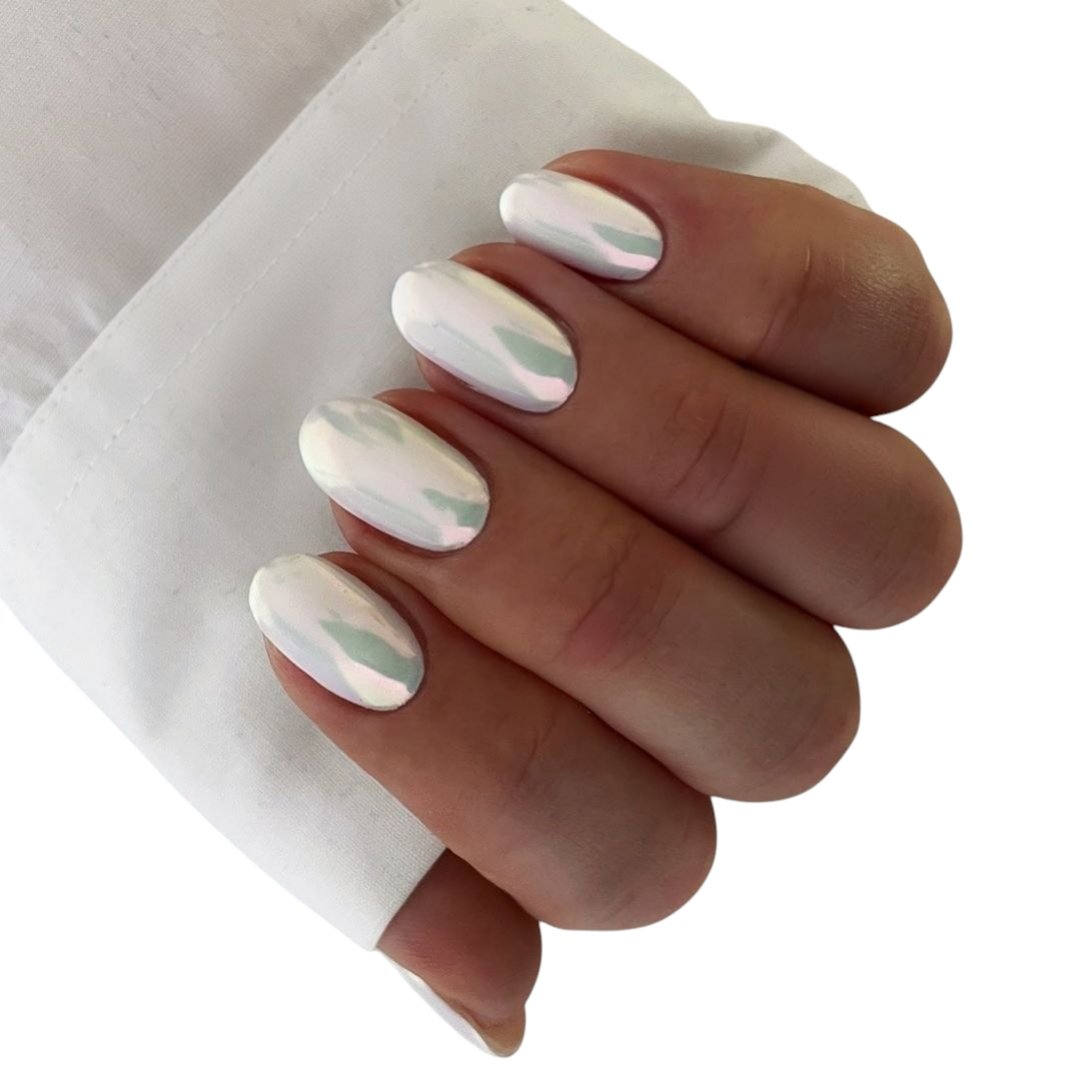 High quality close-up image of elegant manicure showcasing beautifully groomed female hands with glossy polished nails in sophisticated shades.