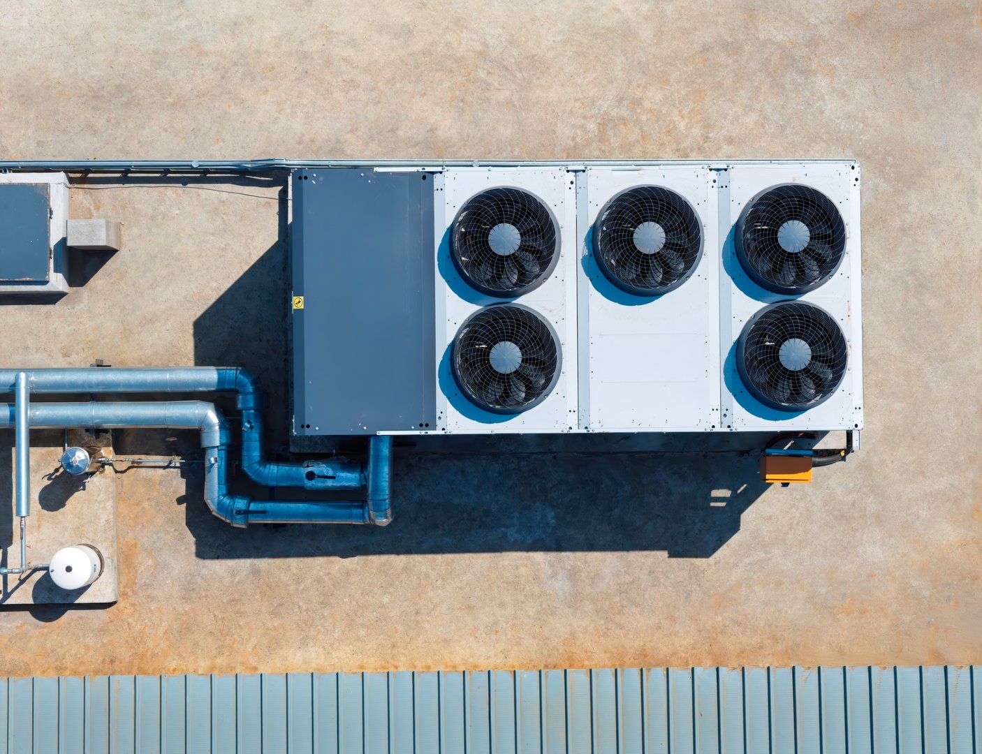 aerial view top down air-conditioning unit industrial hvac on the roof of a building, turbine condenser with fan, efficient cooling solutions