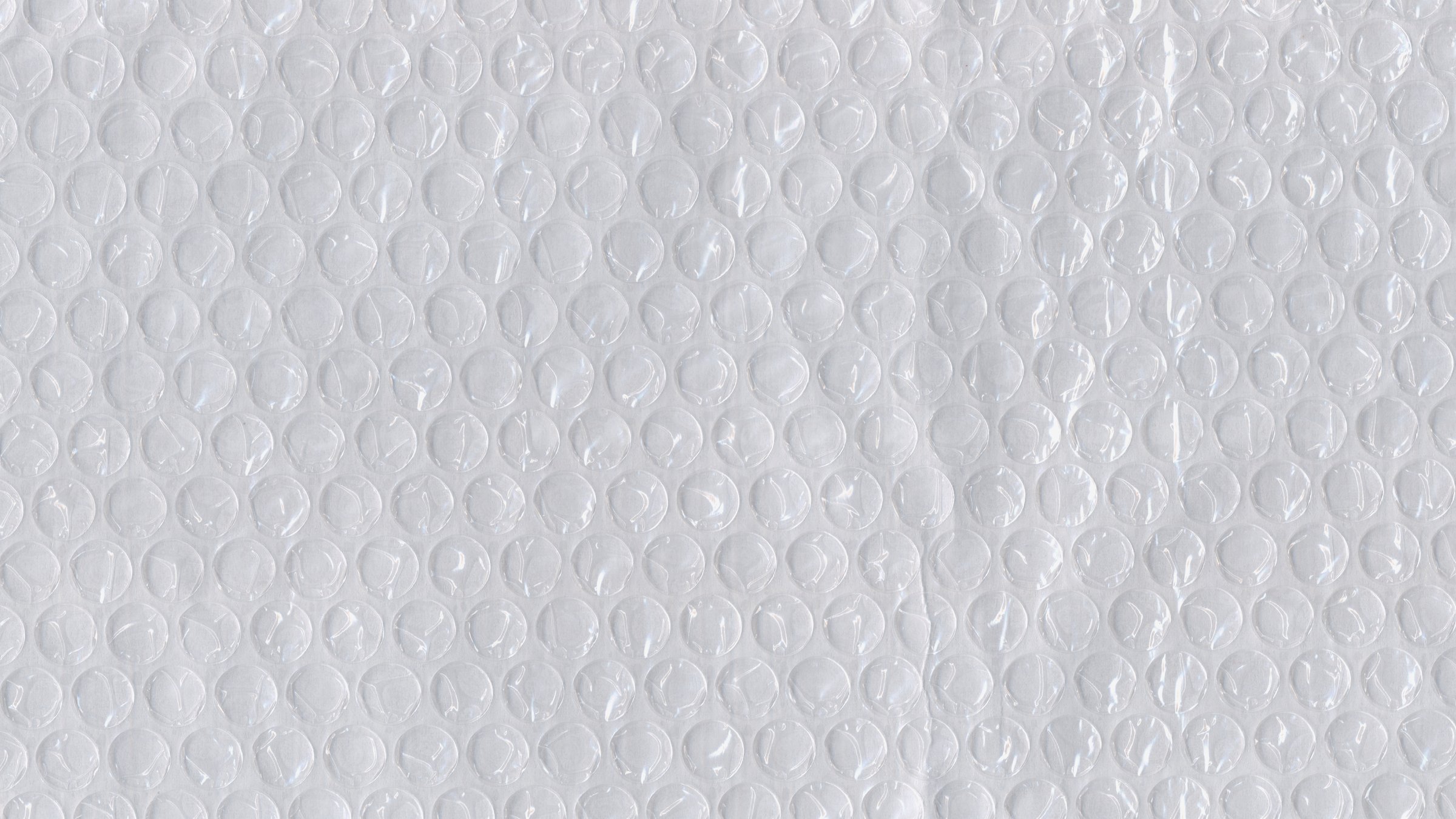 bubble wrap, bubble wrap texture, packaging material, protective wrap, cushioning material, shipping supply, air bubbles, wrapping background, bubble texture, protective packaging, macro texture, air cushion, plastic wrap, package protection,