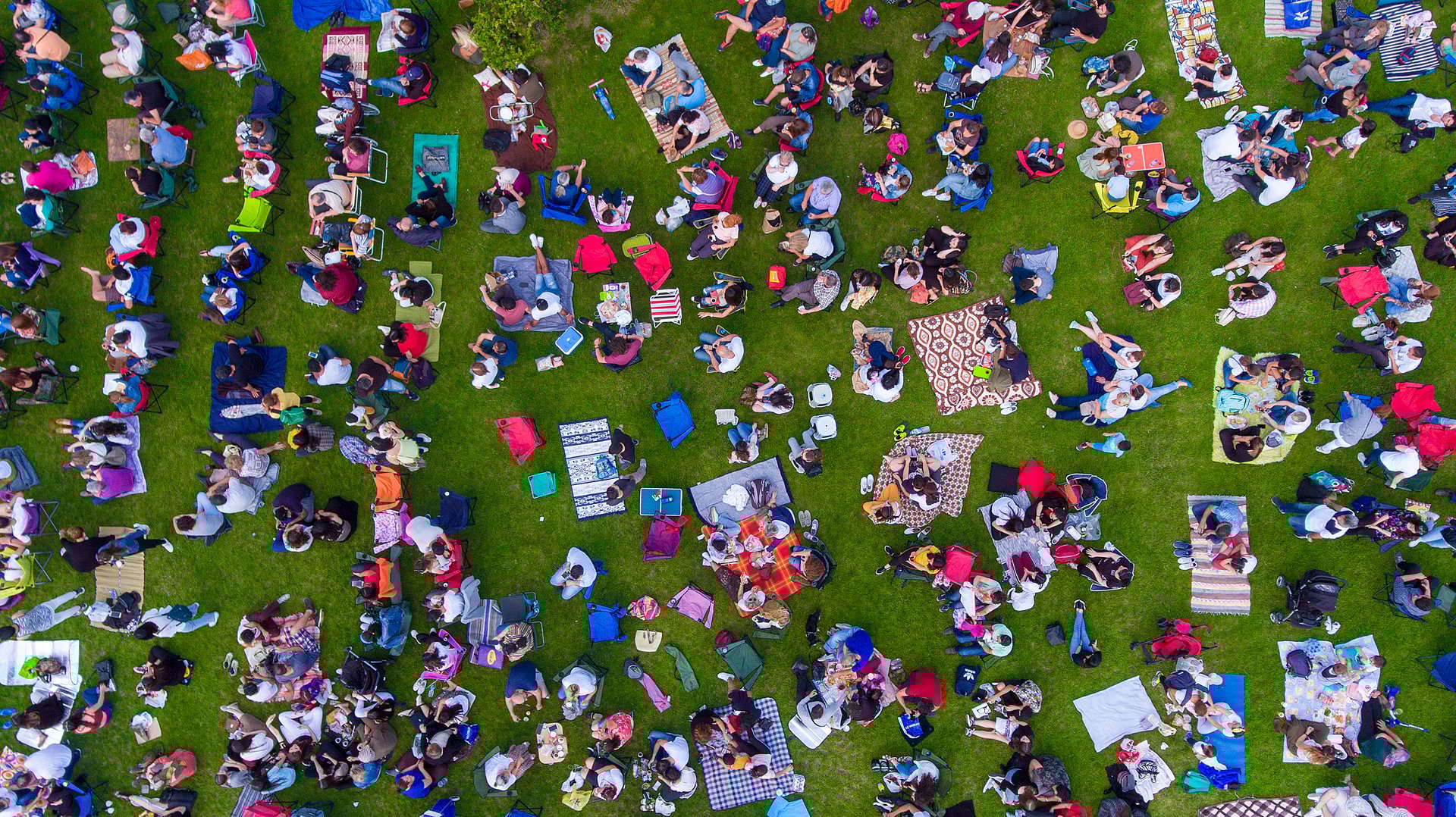 Outdoor day concert with diverse crowd