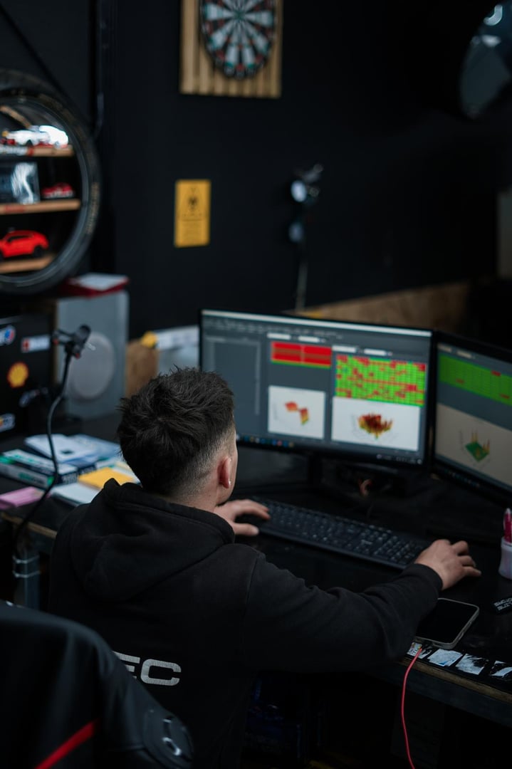 Car mechanic working on dashboard electronic circuit boards, not working correctly, components and tools on the table, close up
