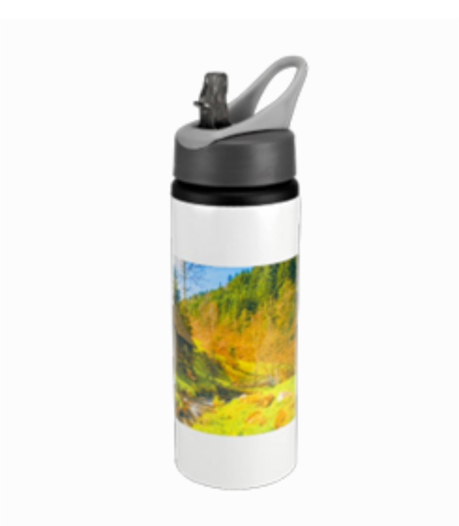 White water bottle with a flip lid and a colorful landscape design featuring trees and a grassy area.