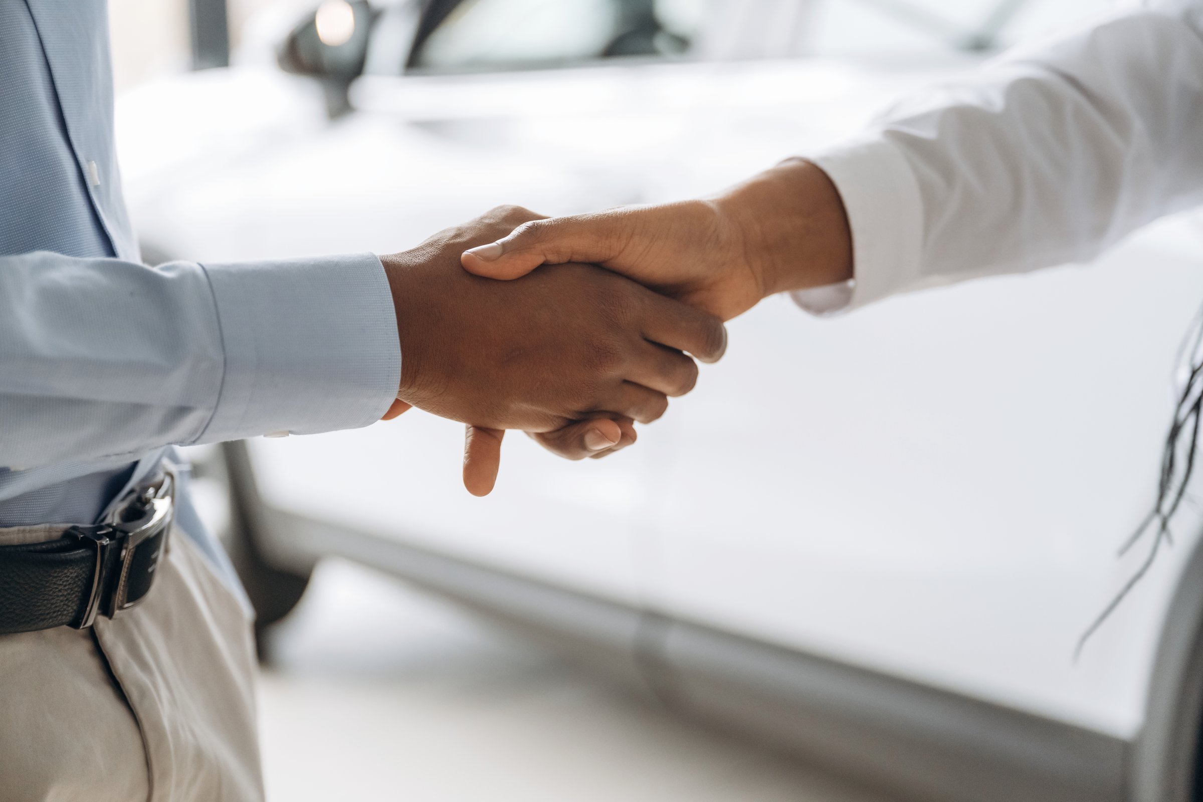 Handshake, close up view of people's hands, business deal.