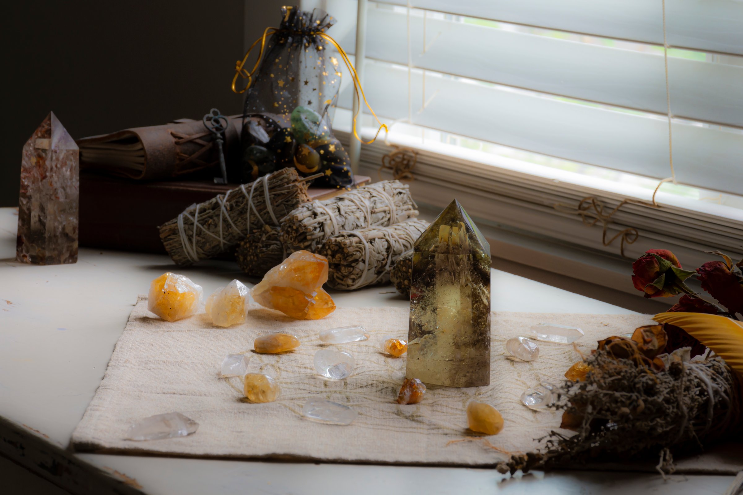 Crystal healing grid using smoky citrine and white sage smudge sticks.